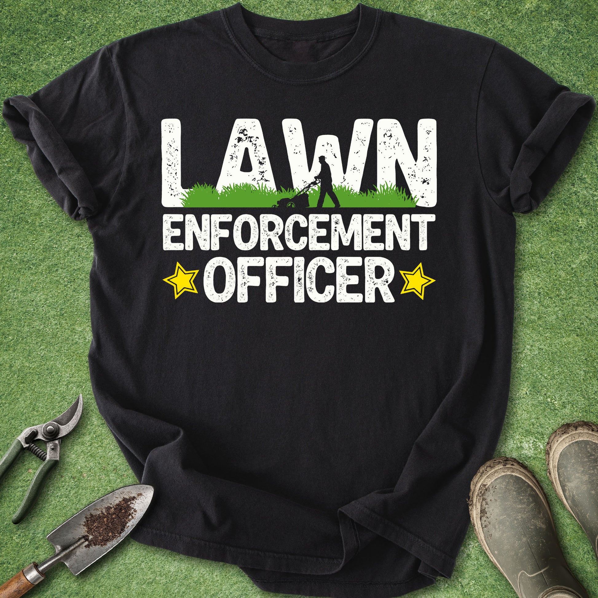 Funny lawn care t-shirt with Lawn Enforcement Officer text and lawn mower silhouette on black shirt