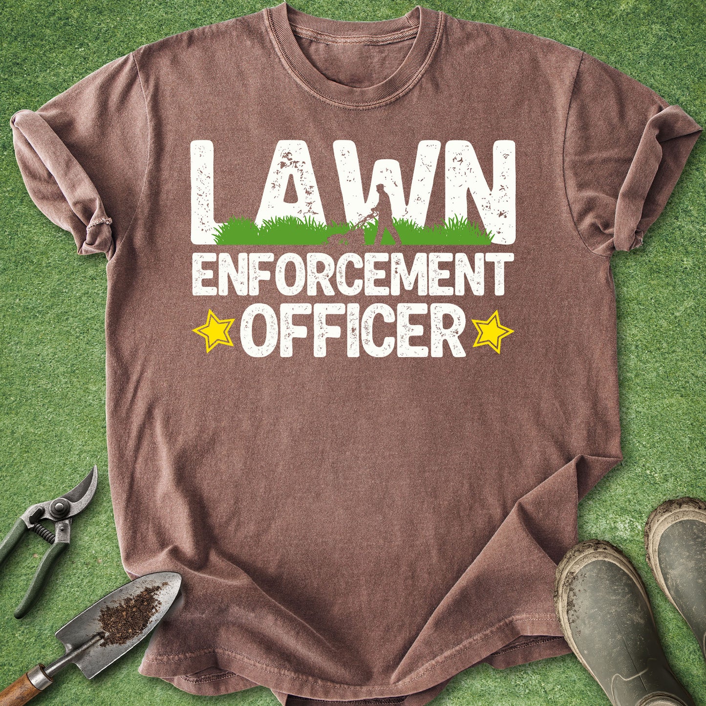 Brown t-shirt with 'Lawn Enforcement Officer' text on a grass background