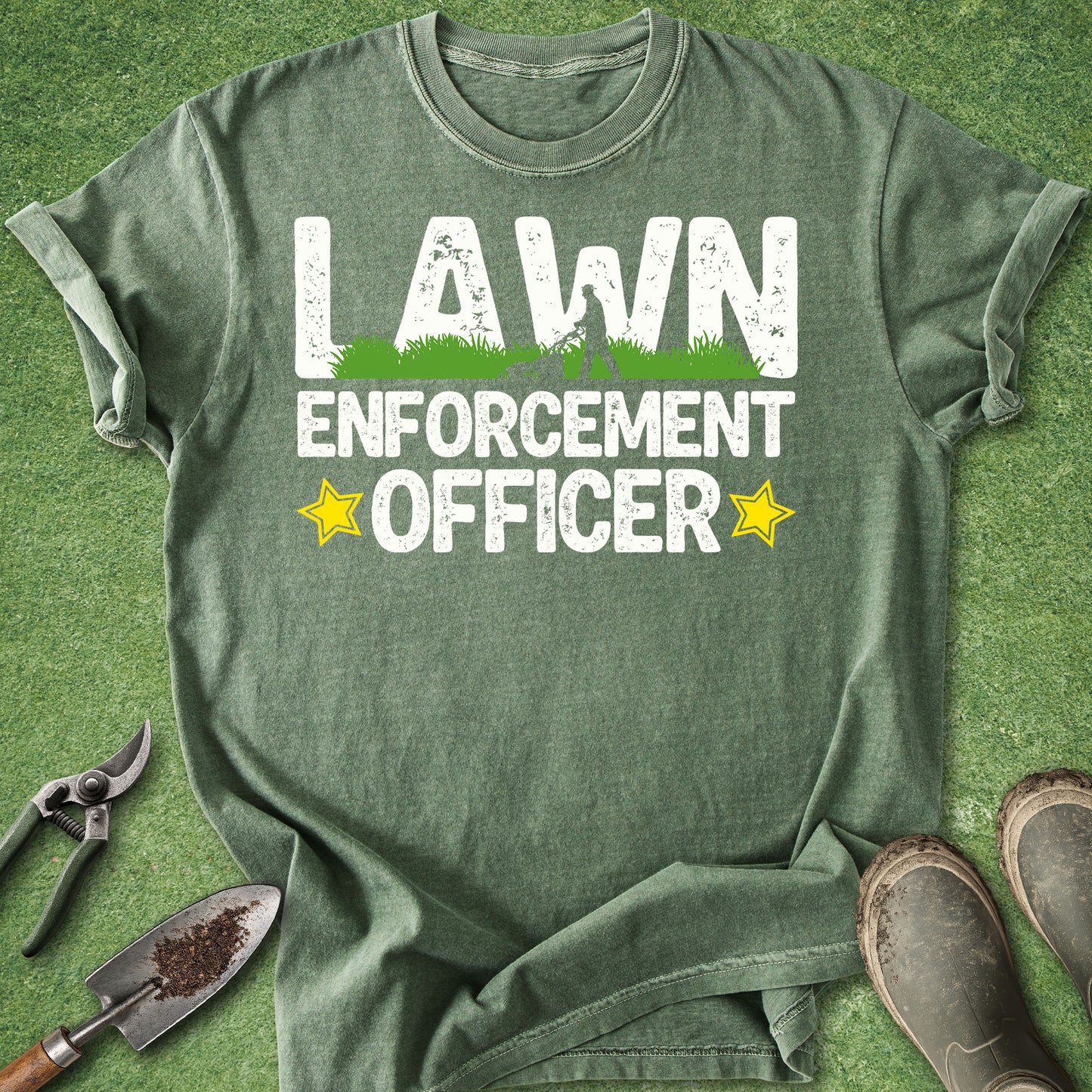 Green t-shirt with 'Lawn Enforcement Officer' text on a grass background