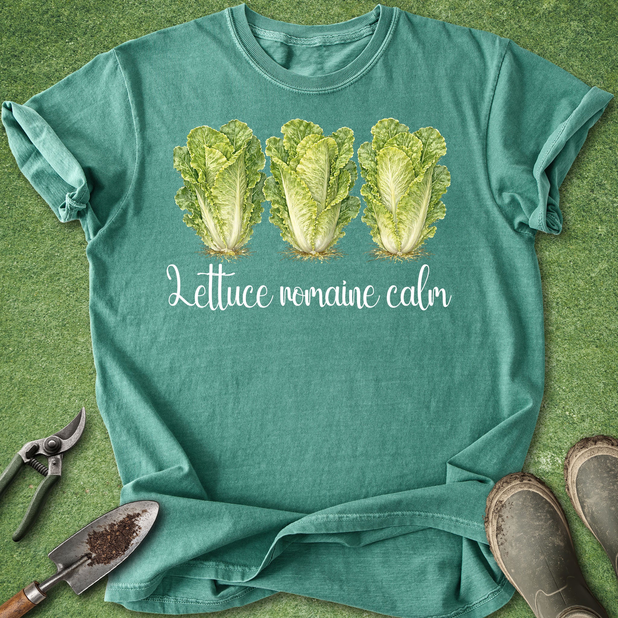 Teal t-shirt with lettuce graphic and text on a green background