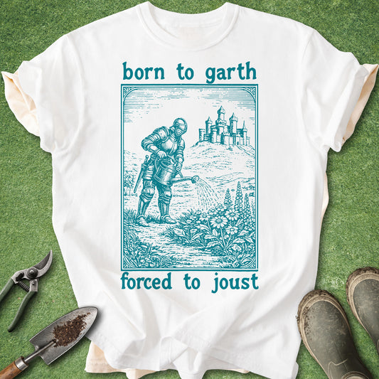 White t-shirt with a graphic design and text 'born to garth, forced to joust' on a green background.