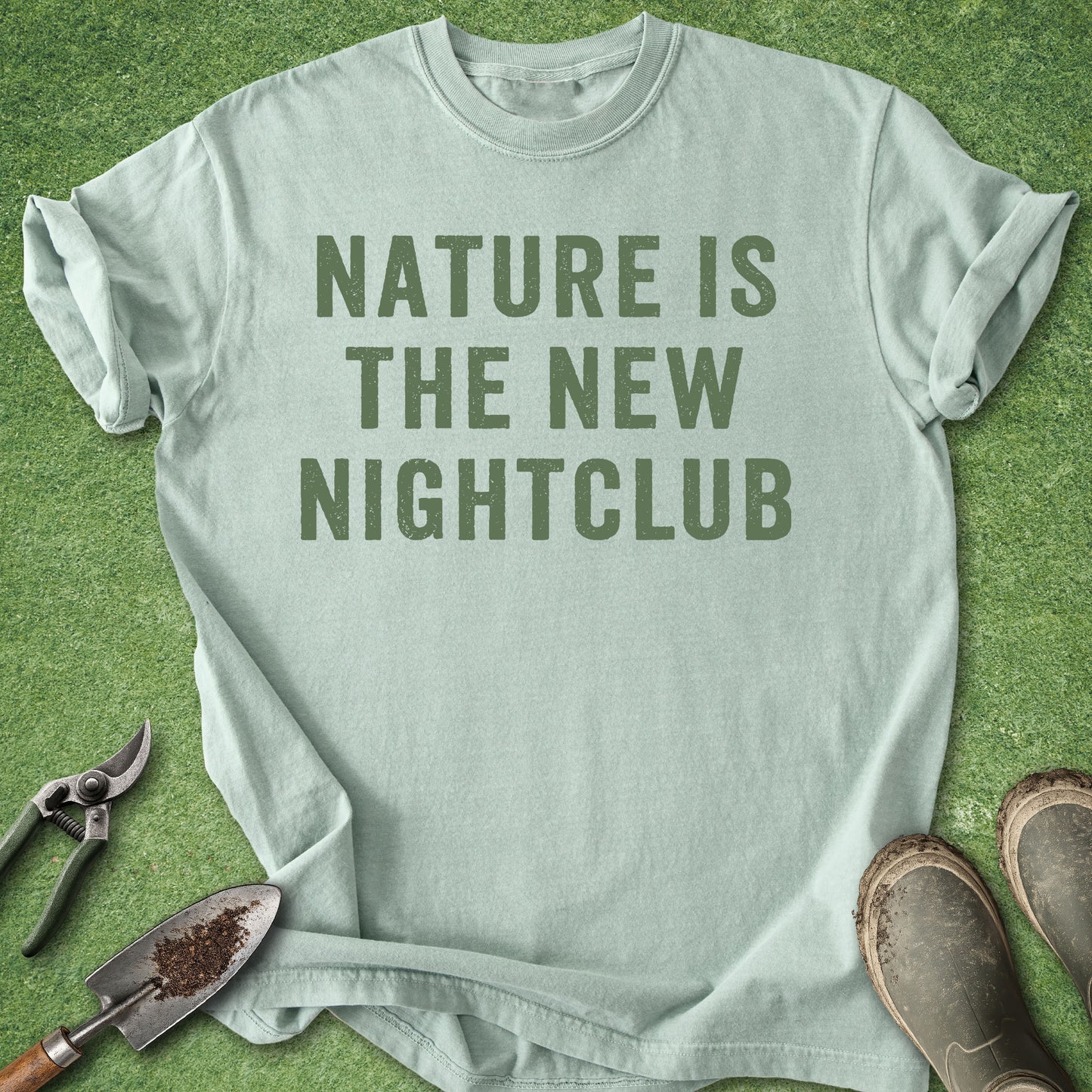 Bay Comfort Colors t-shirt featuring the bold distressed text "Nature Is the New Nightclub" in green minimalist typography.