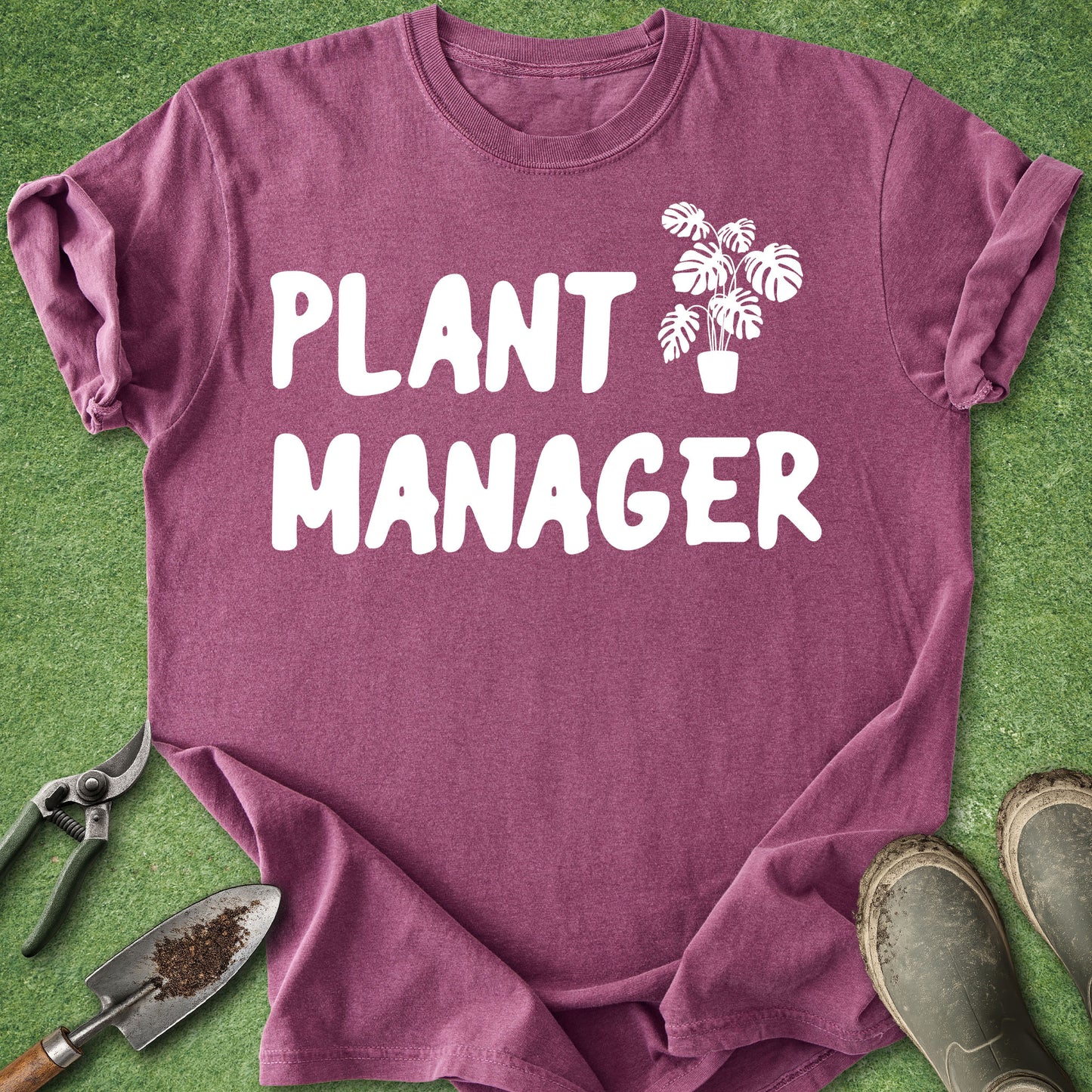 Purple t-shirt with 'Plant Manager' text and plant icon on green grass background