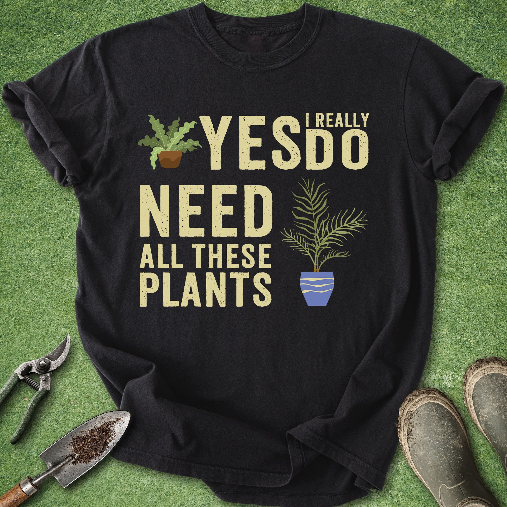 Funny plant lover t-shirt with “Yes I Really Do Need All These Plants” quote and potted plant illustrations on black shirt