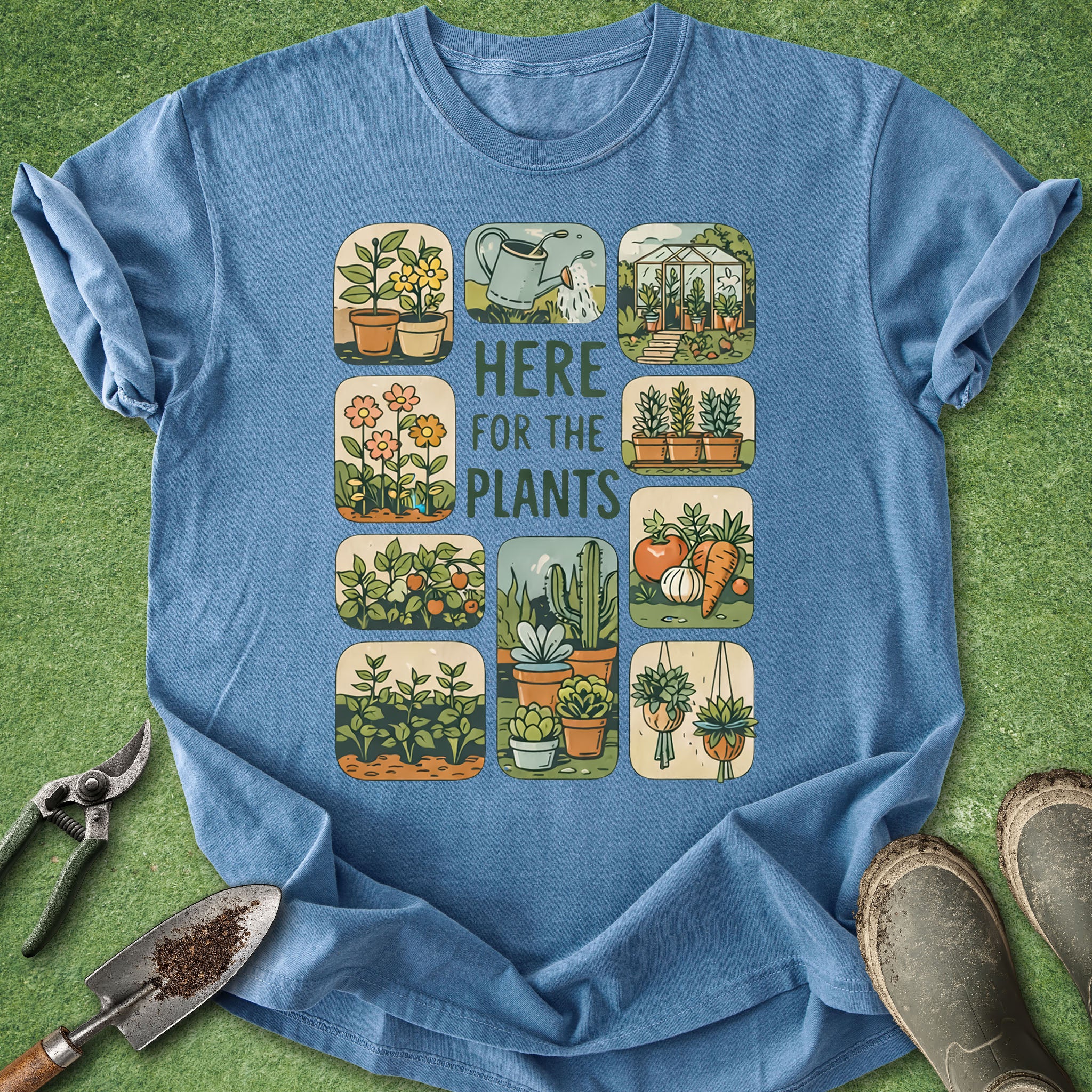 Blue t-shirt with gardening-themed design on a green background
