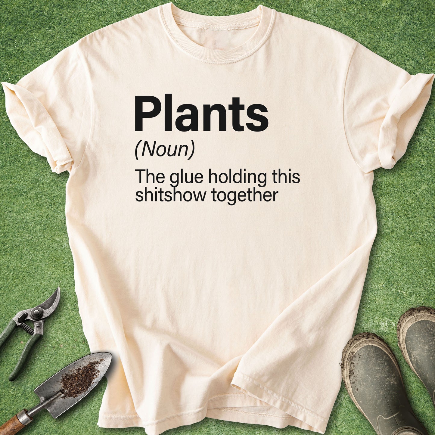 Minimalist typography design reading "Plants (Noun) The glue holding this shitshow together" printed on a Comfort Colors 1717 gardening and plant lover t-shirt.