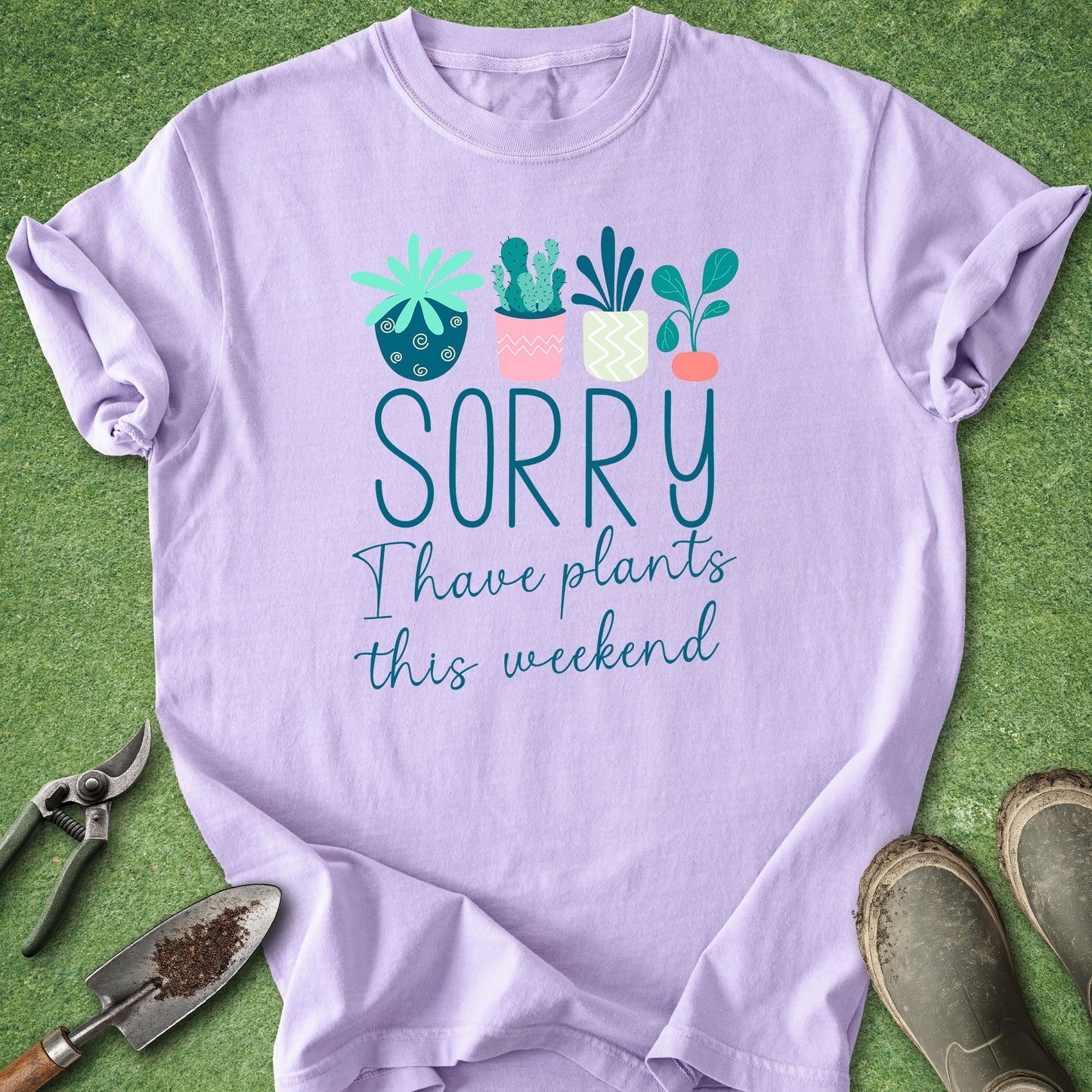 Light blue t-shirt with “Sorry I Have Plants This Weekend” text and illustrated houseplants