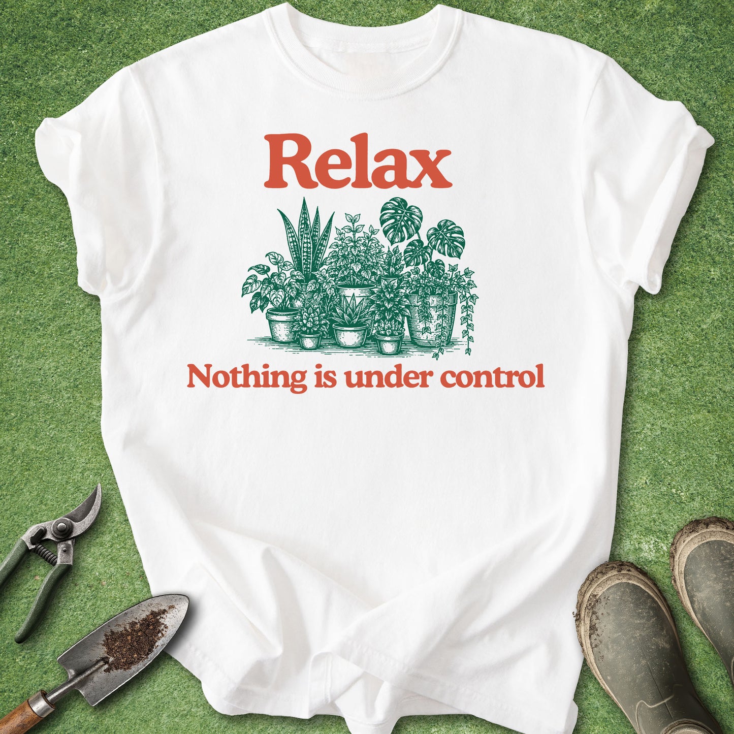 Comfort Colors white t-shirt featuring the phrase "Relax Nothing Is Under Control" above and below a vintage-style illustration of assorted houseplants in pots.