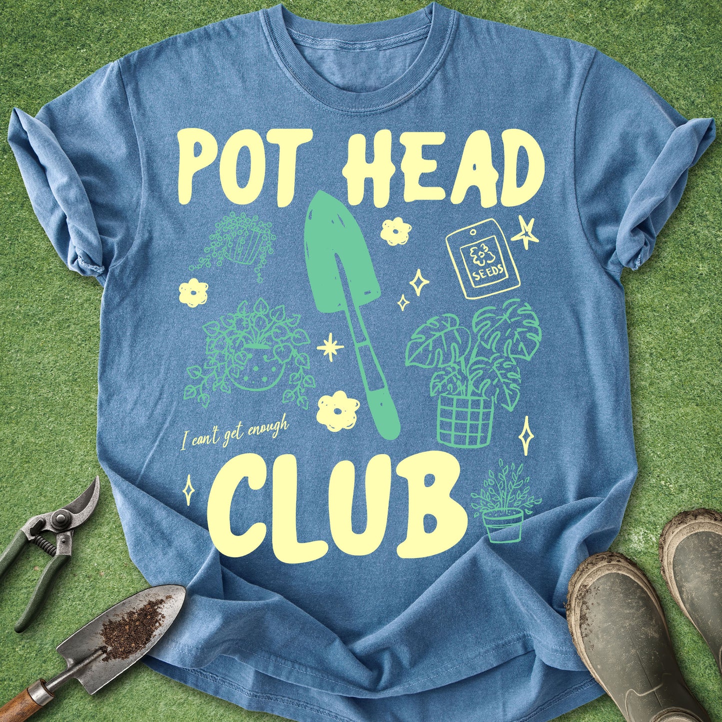 Blue t-shirt with 'POT HEAD CLUB' text and gardening graphics on a green background
