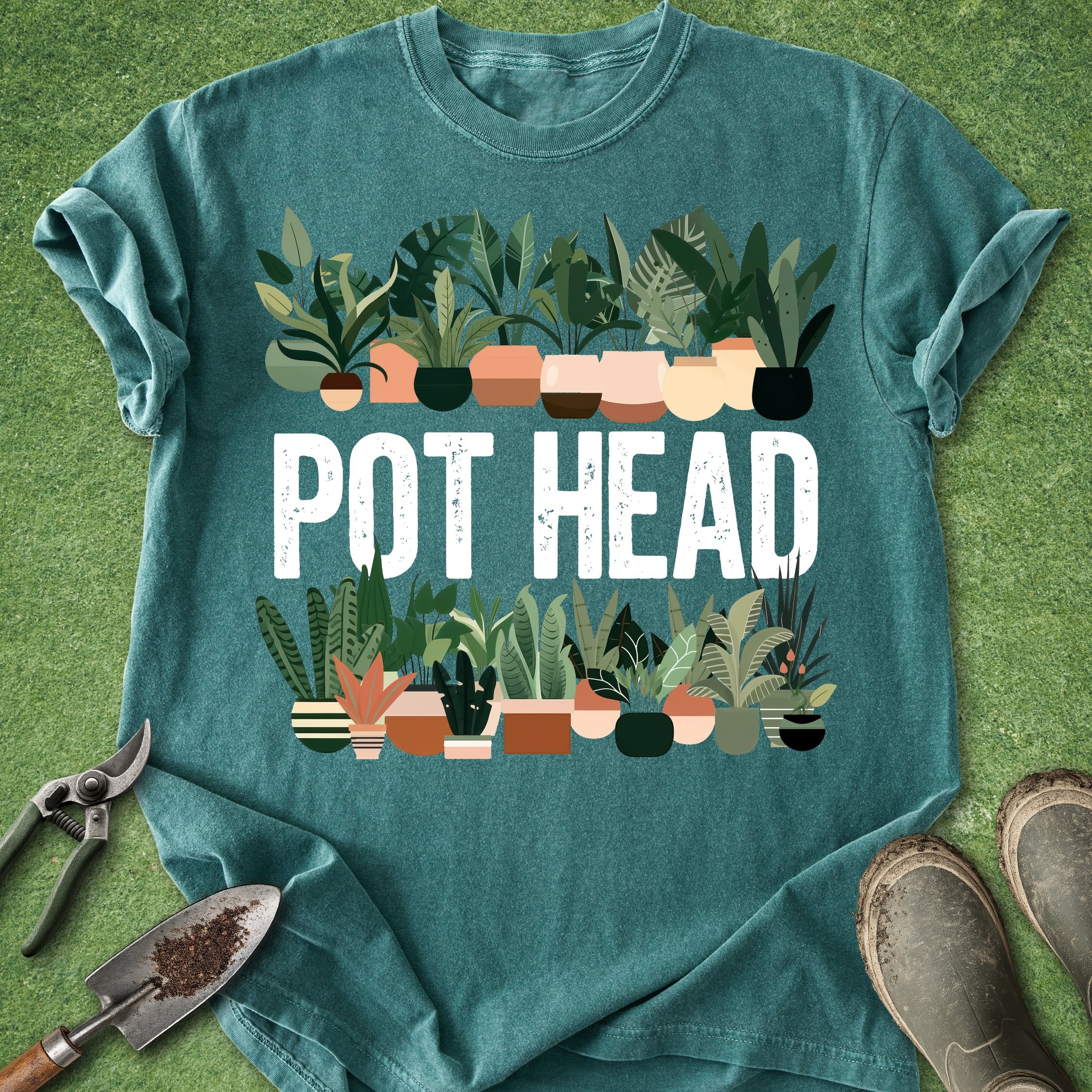 Teal t-shirt with 'POT HEAD' graphic and potted plants on a green background