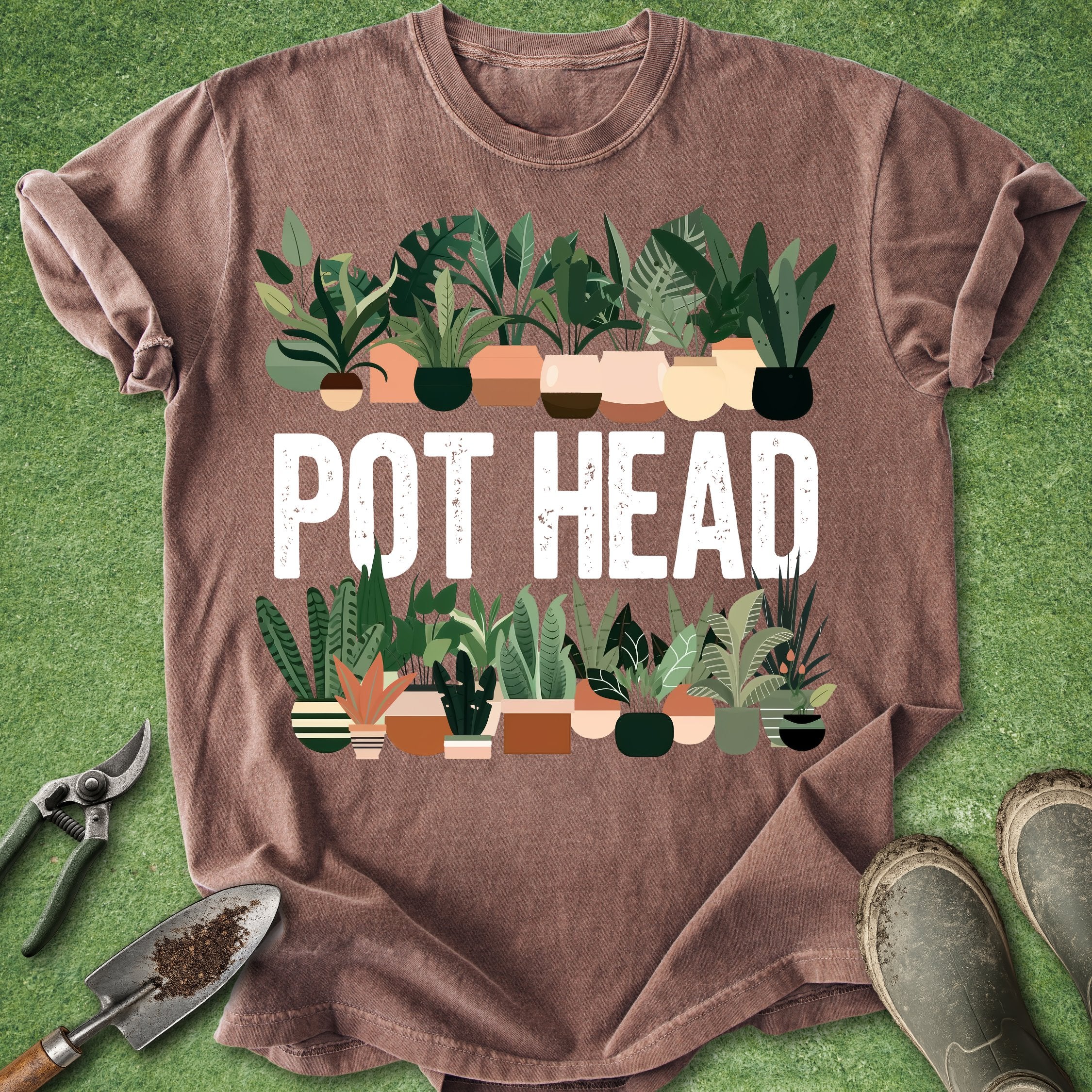 Brown t-shirt with 'POT HEAD' text and plant graphics on a green background