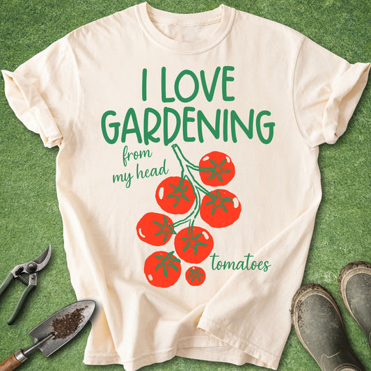 Beige t-shirt with 'I love gardening from my head tomatoes' text and tomato graphic on a green background.