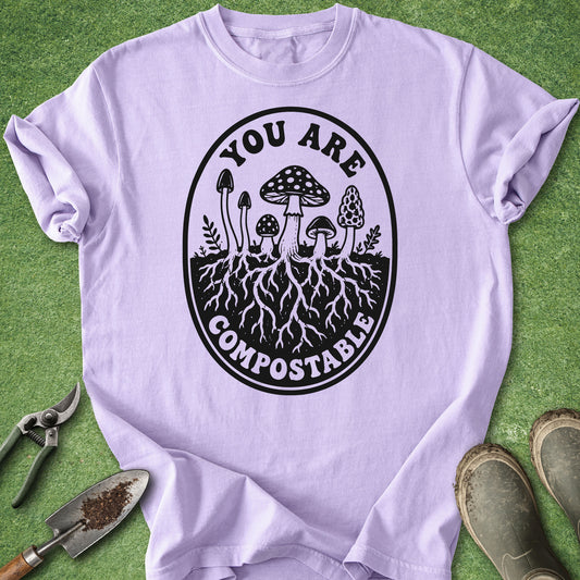 Light purple t-shirt with compostable graphic on a green background