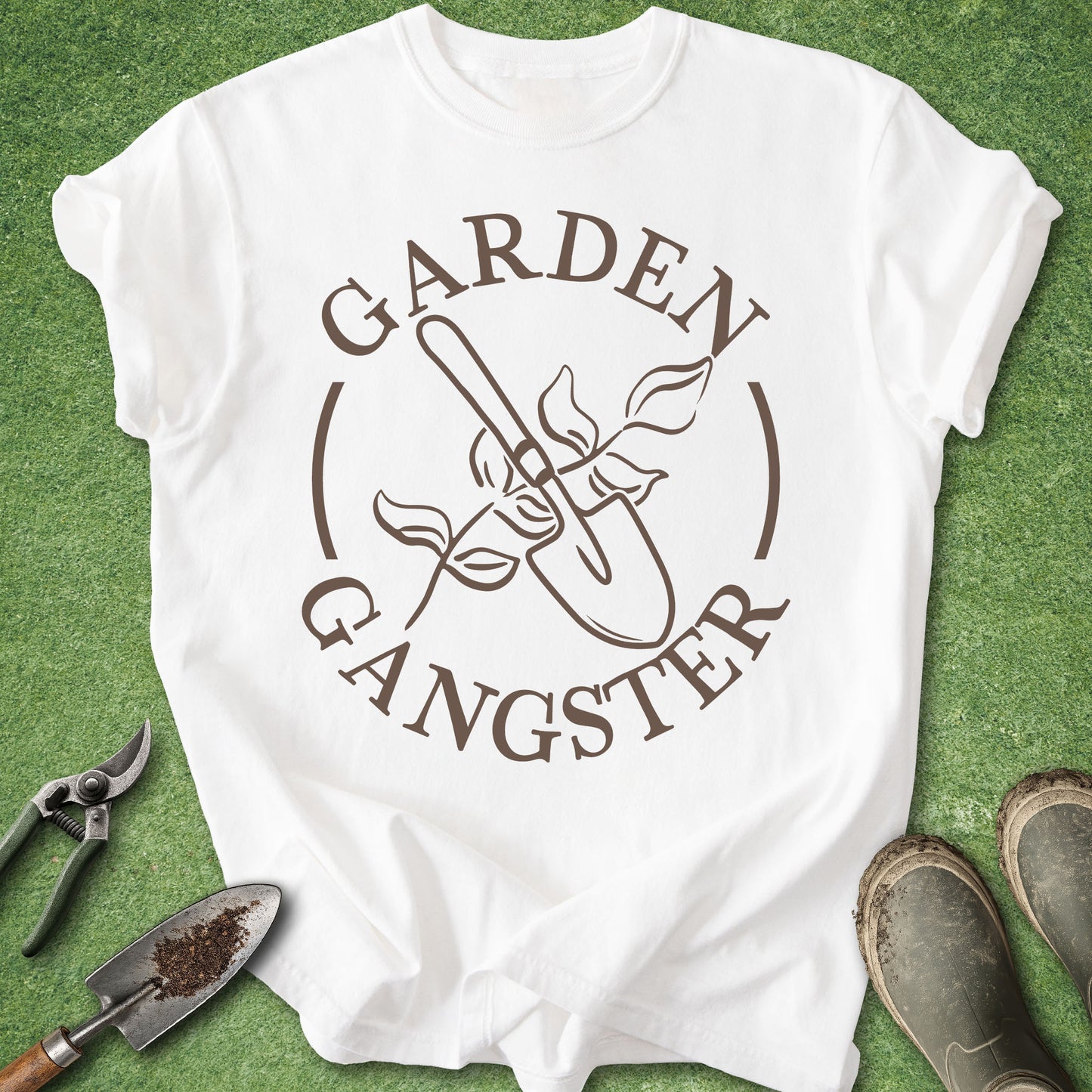 White t-shirt with 'Garden Gangster' graphic on a green background with gardening tools.
