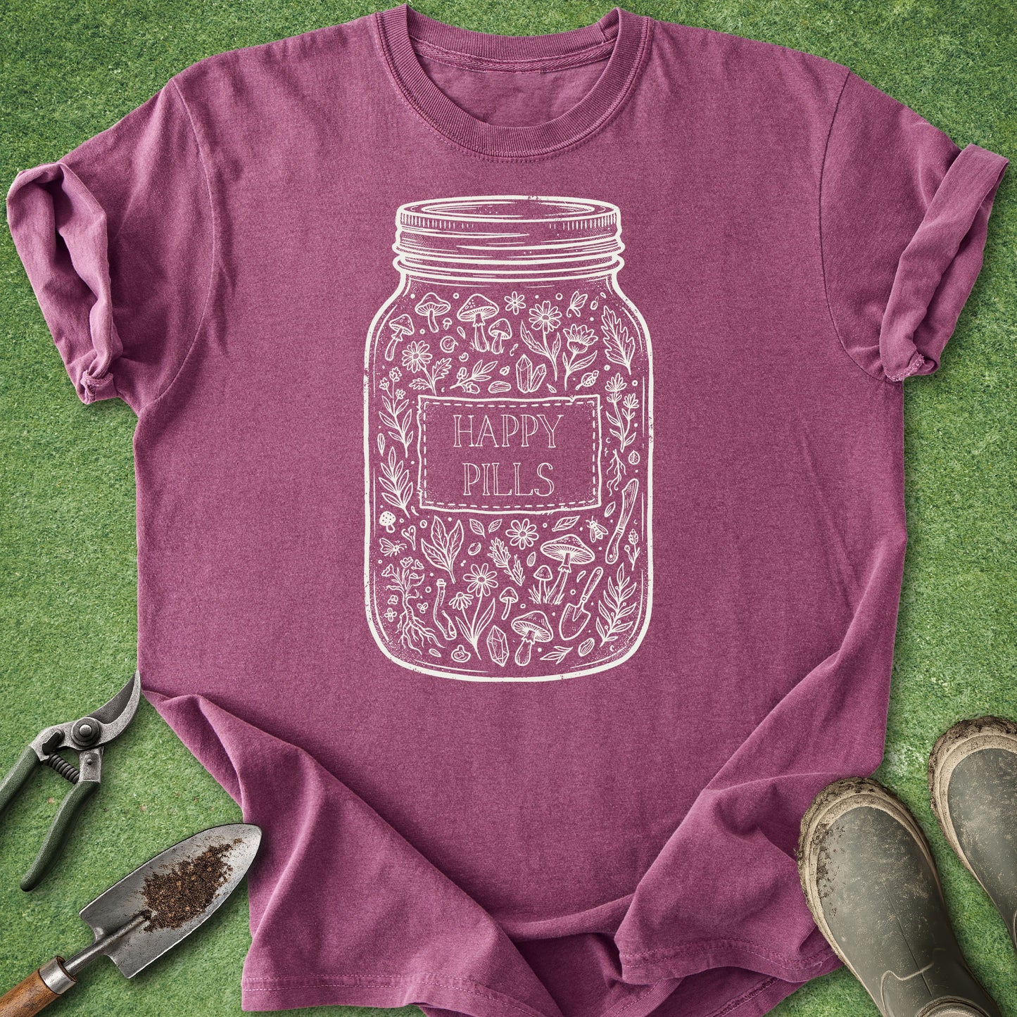 Purple t-shirt with 'Happy Pills' jar design on a green background