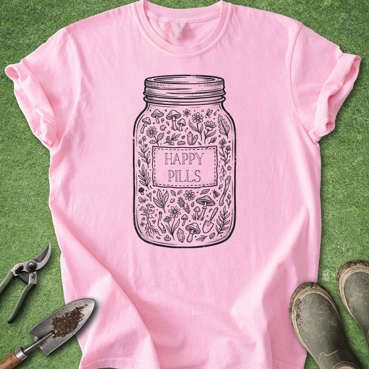Pink t-shirt with 'Happy Pills' jar design on a green background