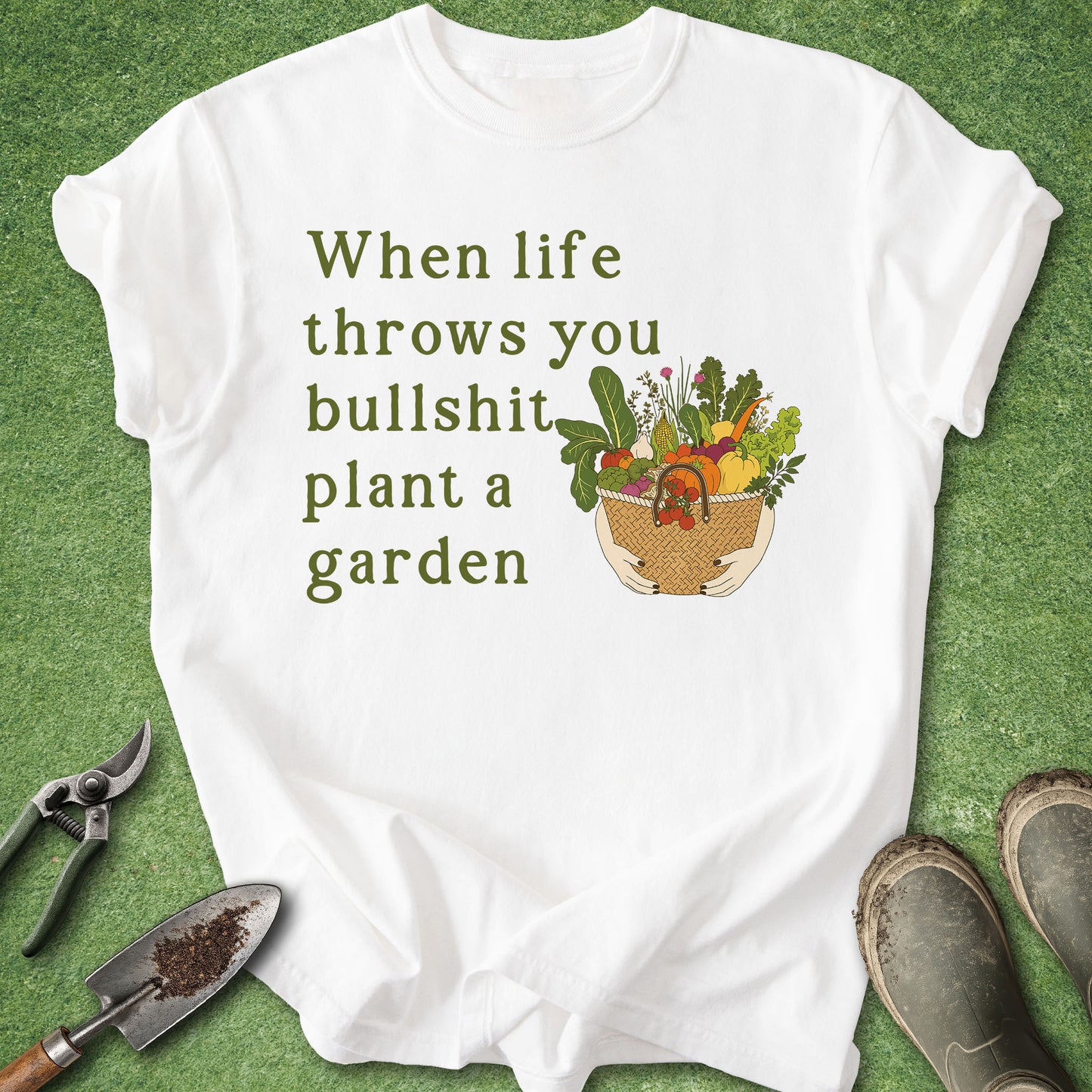White t-shirt with gardening graphic and text on a green background