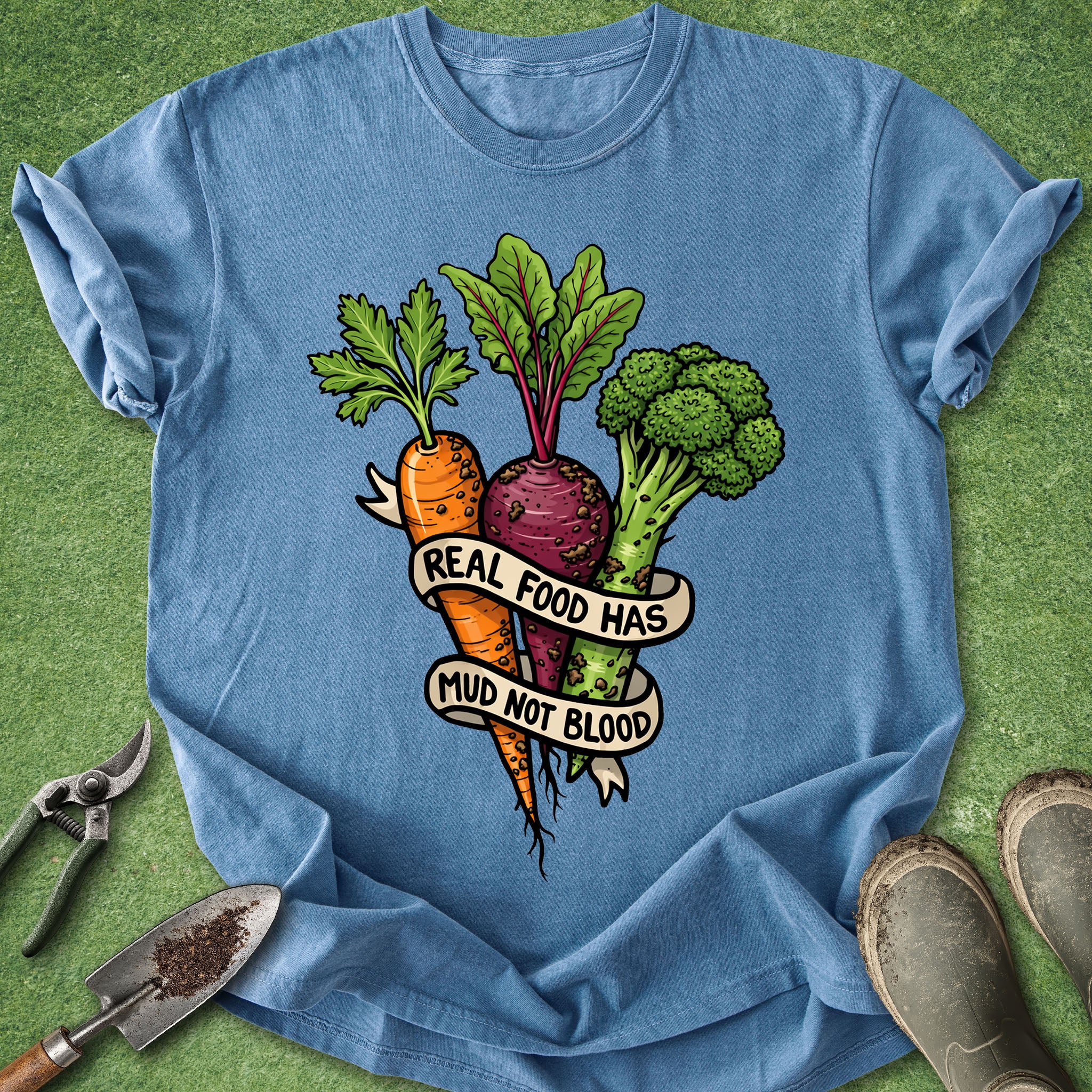Blue t-shirt with vegetable graphic and text on a green background