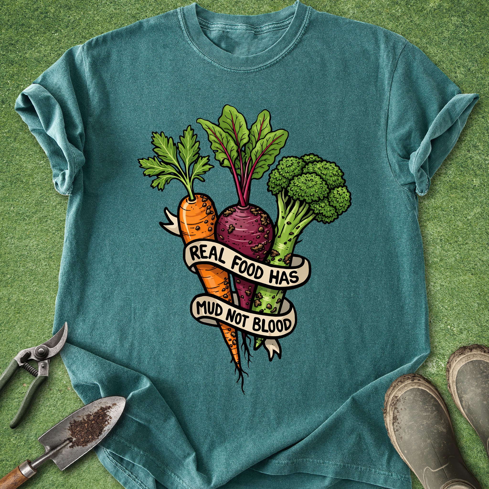 Teal t-shirt with vegetable graphic and text on a green background