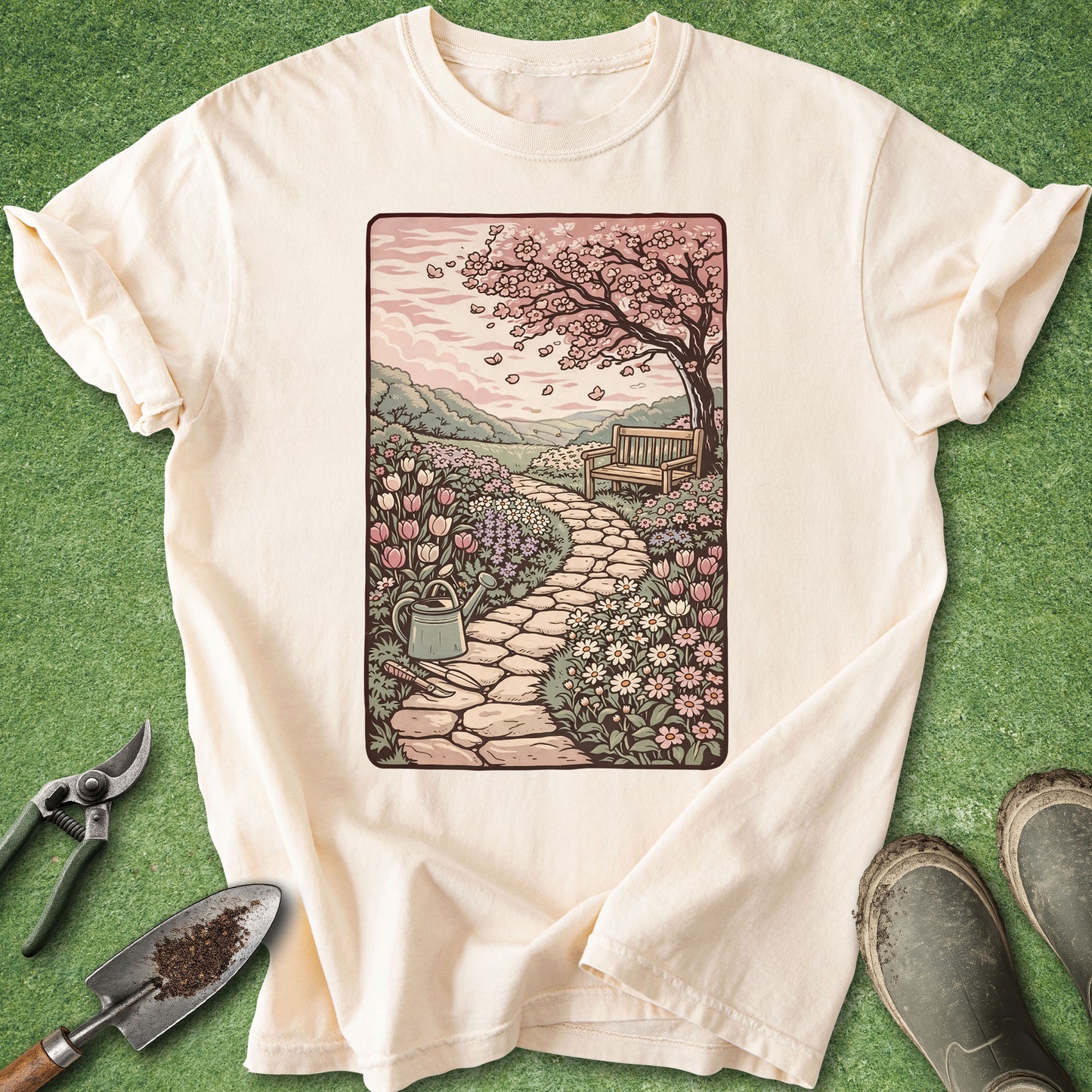 Beige t-shirt with a garden illustration on a green background