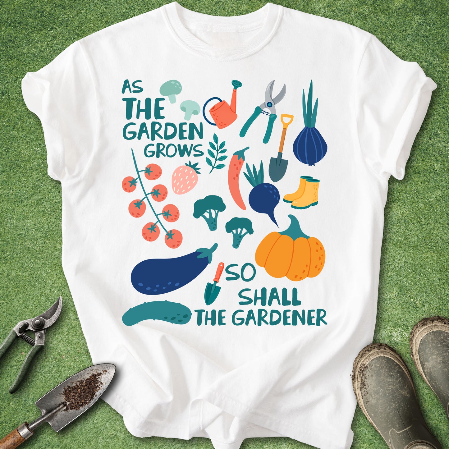 White t-shirt with gardening-themed design and tools on a green background
