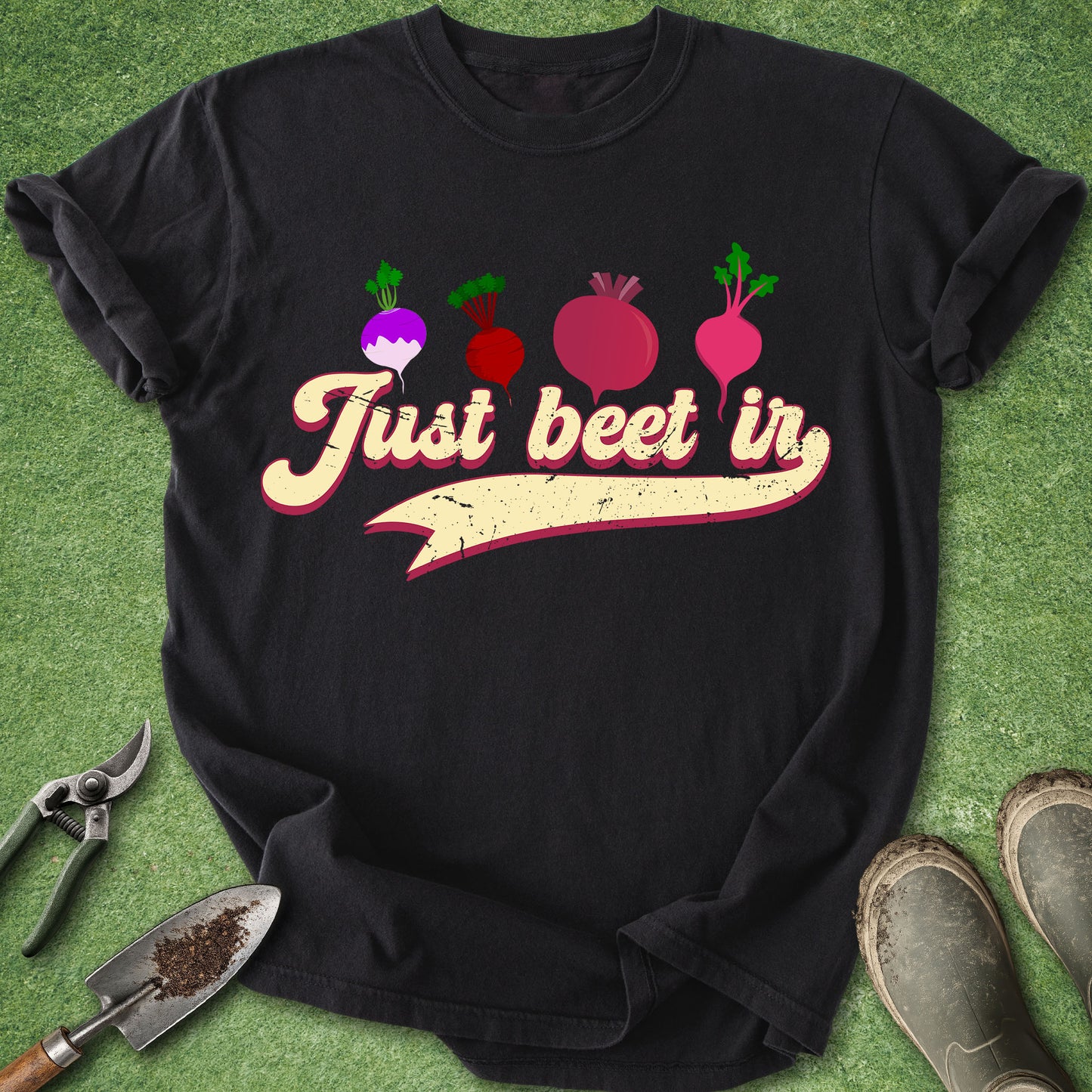Black t-shirt with 'Just beet in' text and beet graphics on a green background with gardening tools.