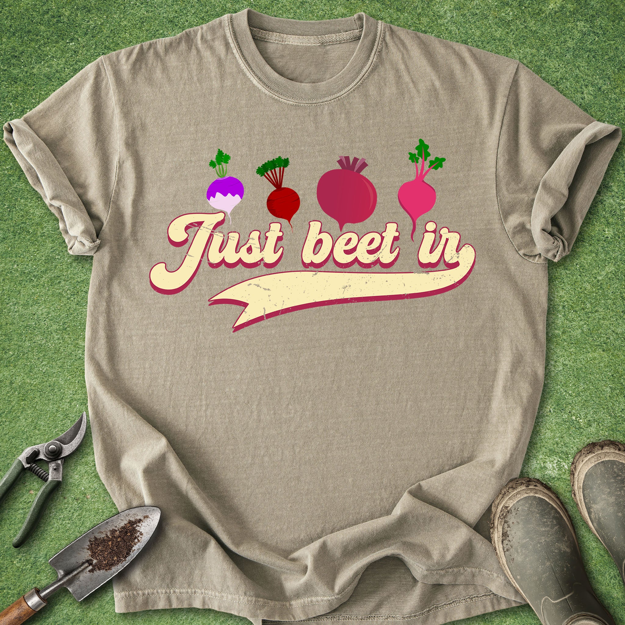 Beige t-shirt with 'Just beet in' text and beet graphics on a green background