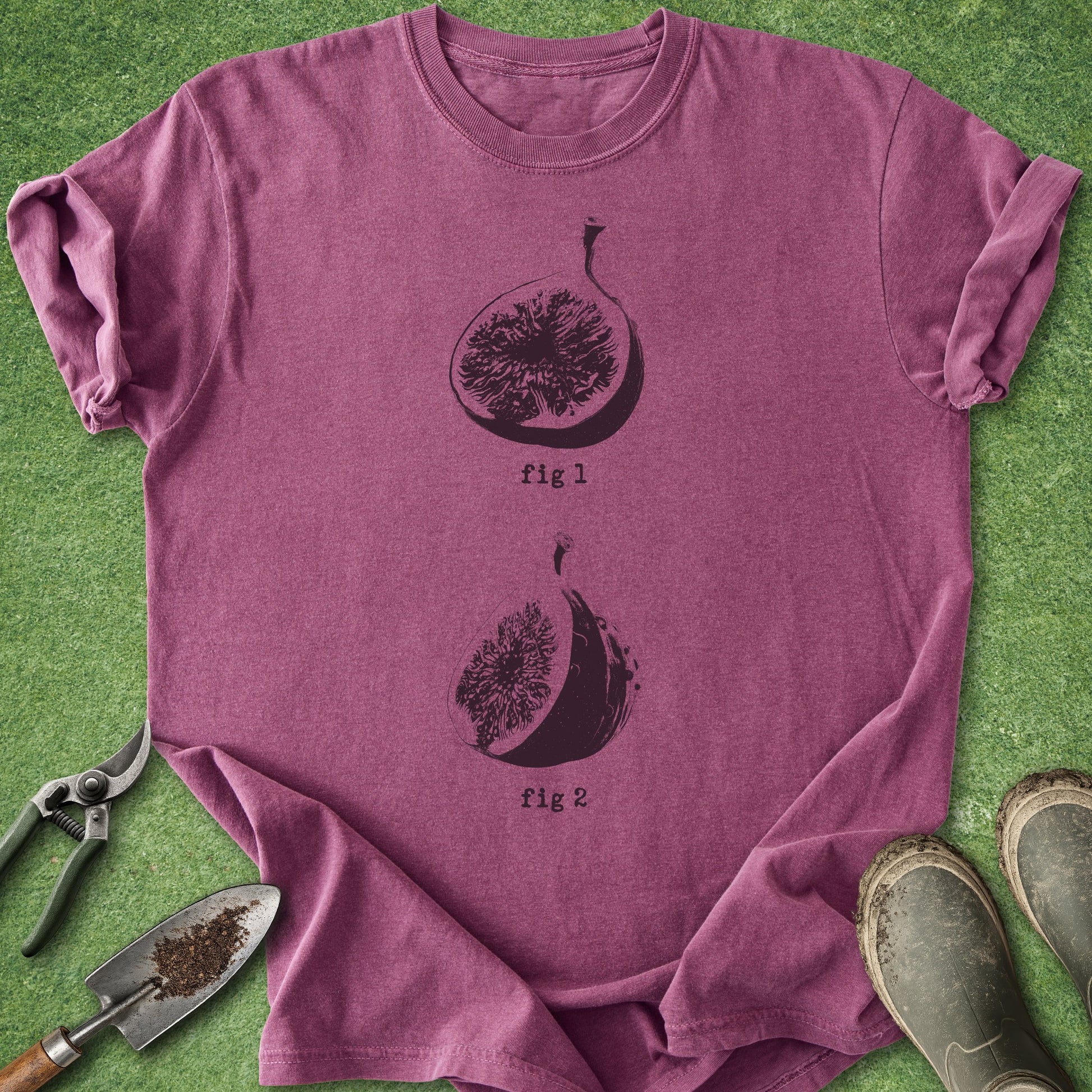Purple t-shirt with fig design on a green grass background
