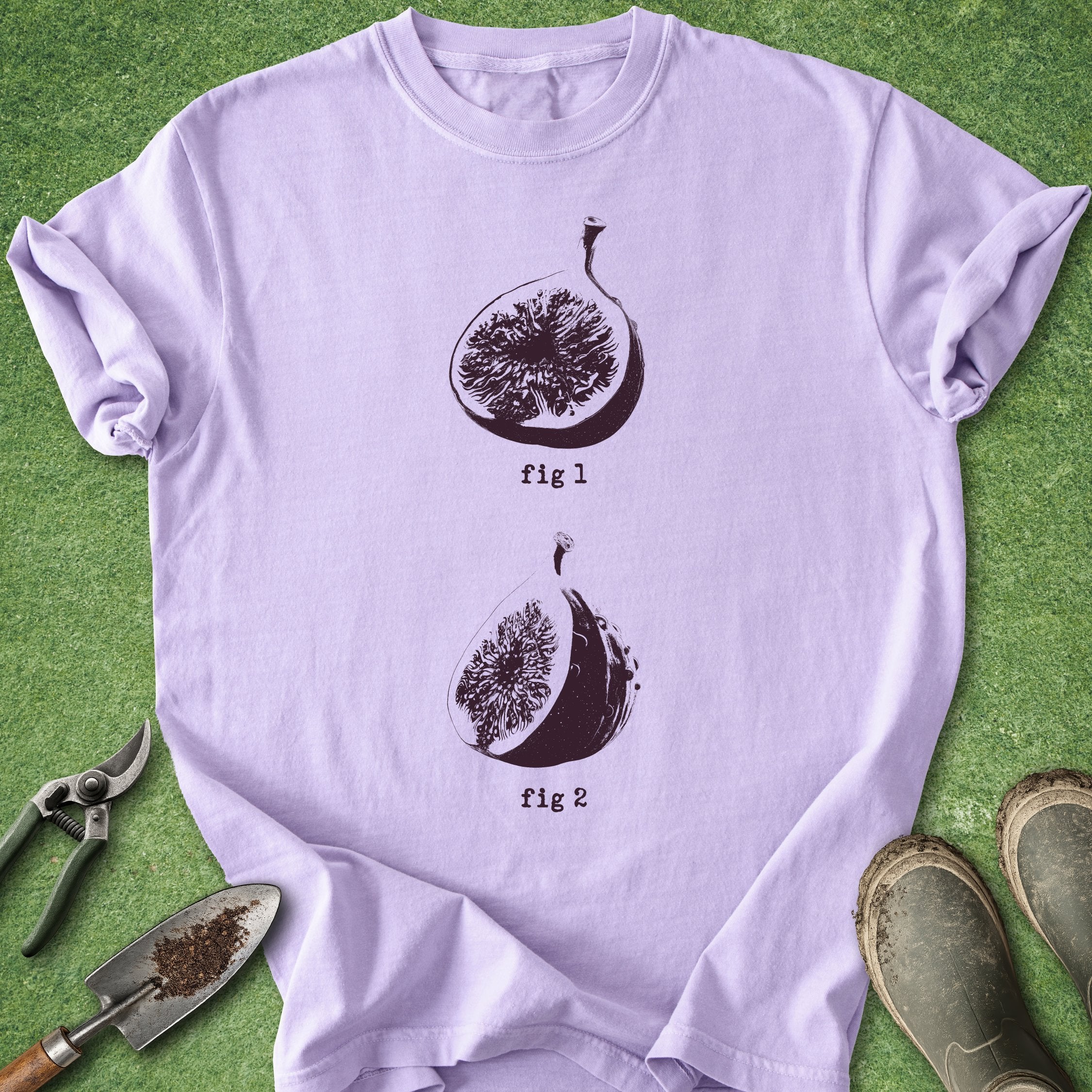 Light purple t-shirt with fig illustrations on a green background