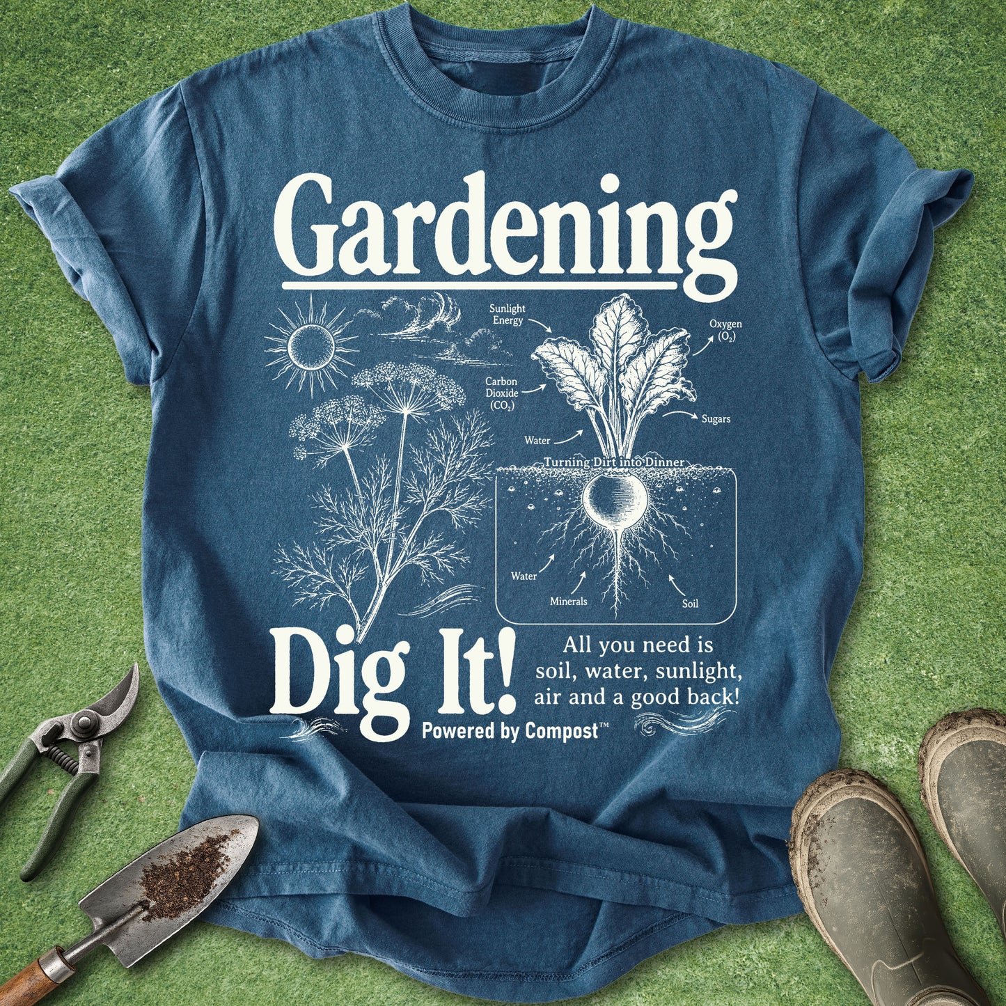 Blue t-shirt with gardening graphic and text on a grass background