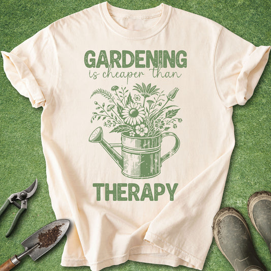 Beige t-shirt with green gardening graphic and text on a grass background