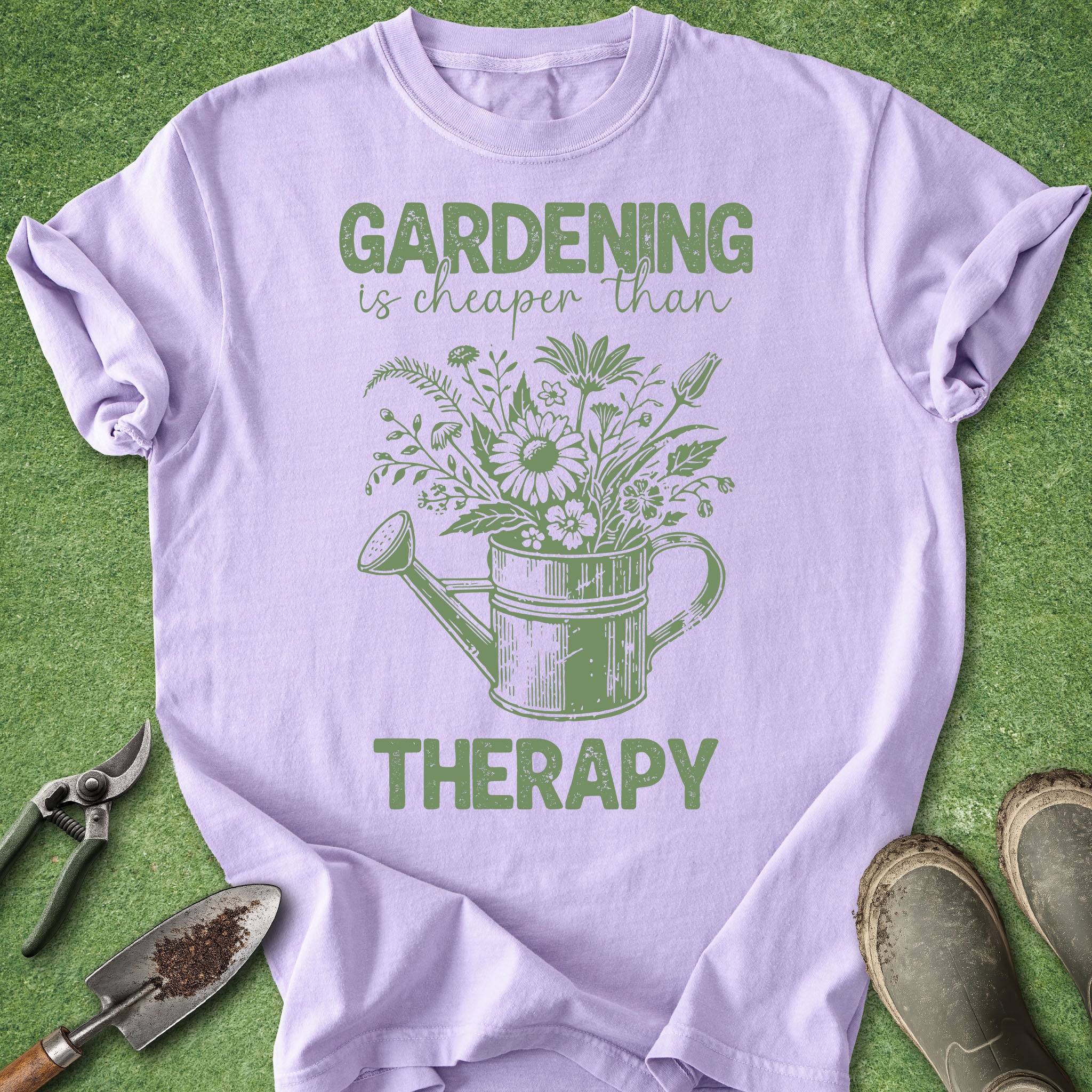 Purple t-shirt with green graphic and text 'Gardening is cheaper than therapy' on a green background.