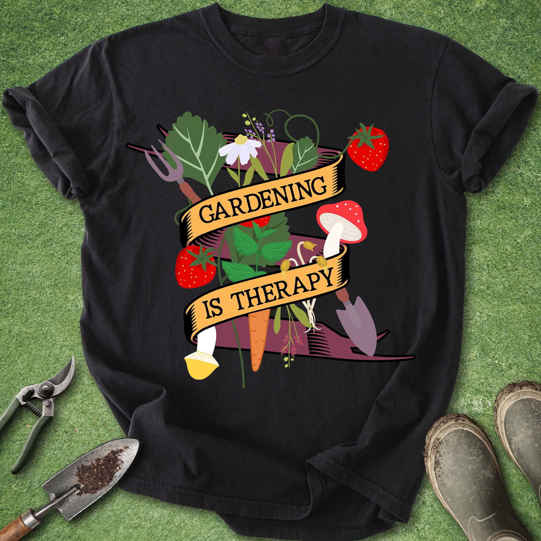 Black t-shirt with 'Gardening is Therapy' design on a green grass background