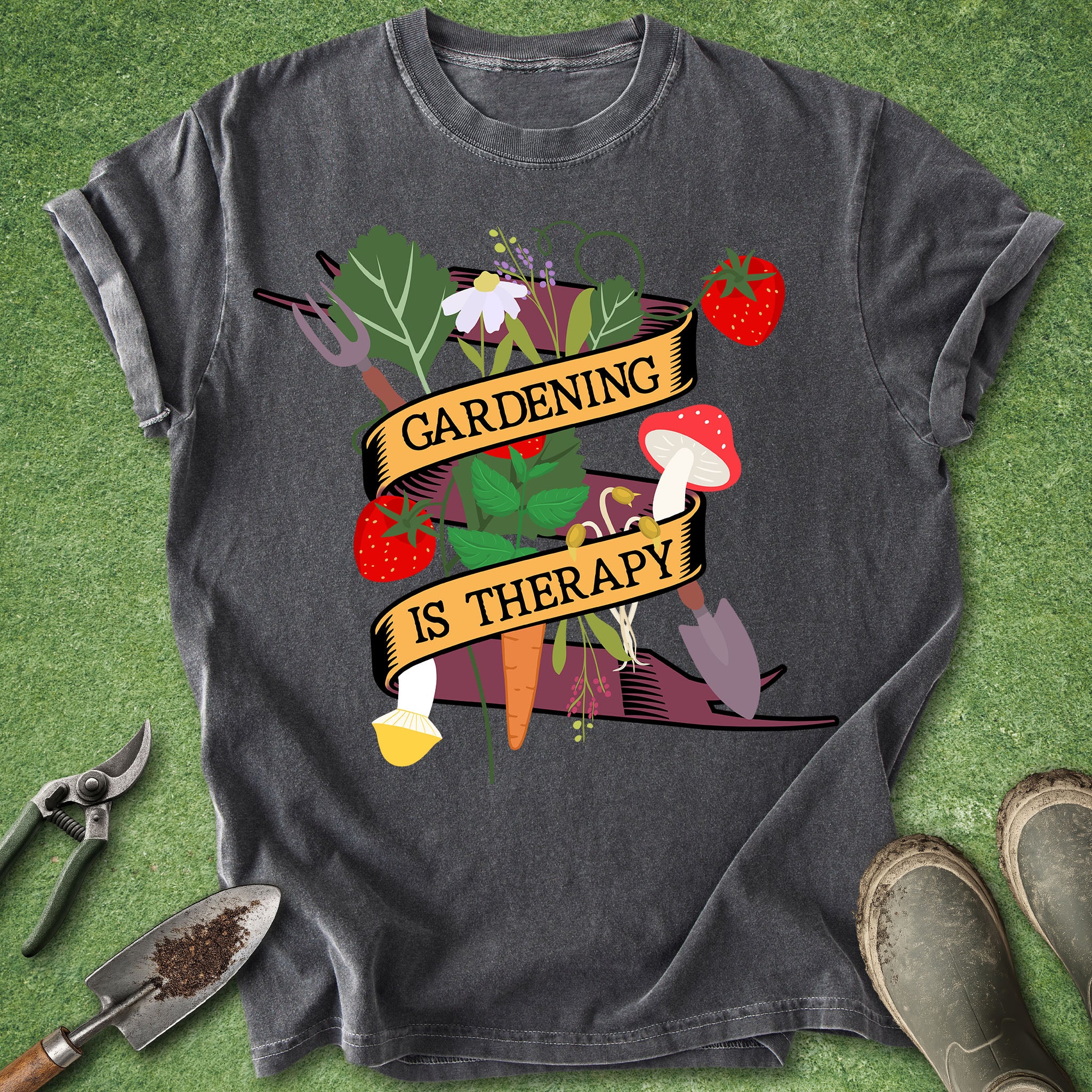 Gray t-shirt with 'Gardening is Therapy' design on a green grass background