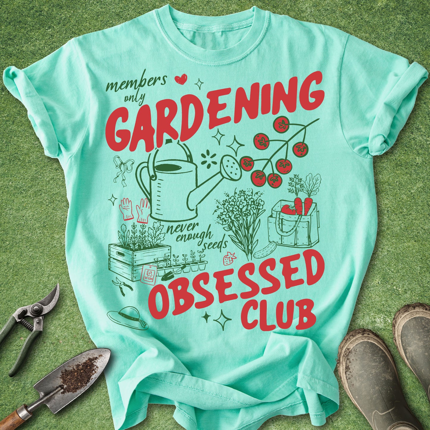 Light blue t-shirt with gardening-themed design on a green background