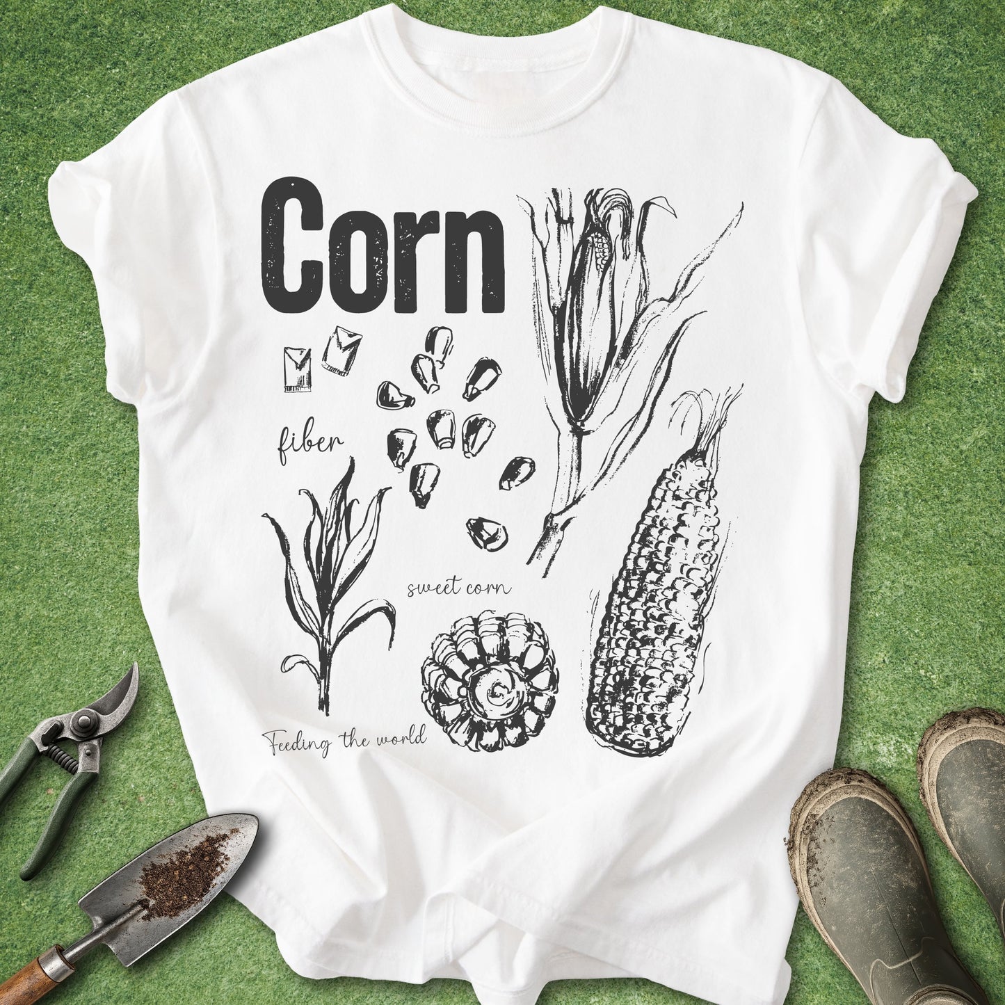 White t-shirt with corn illustration and text on a green background