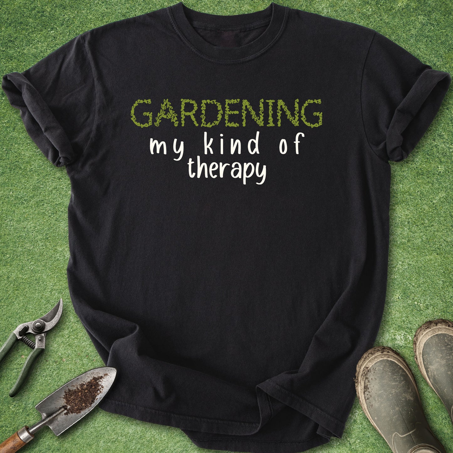 Comfort Colors black t-shirt featuring the phrase "Gardening Is My Kind of Therapy" in minimalist green and white typography for gardeners and plant lovers.