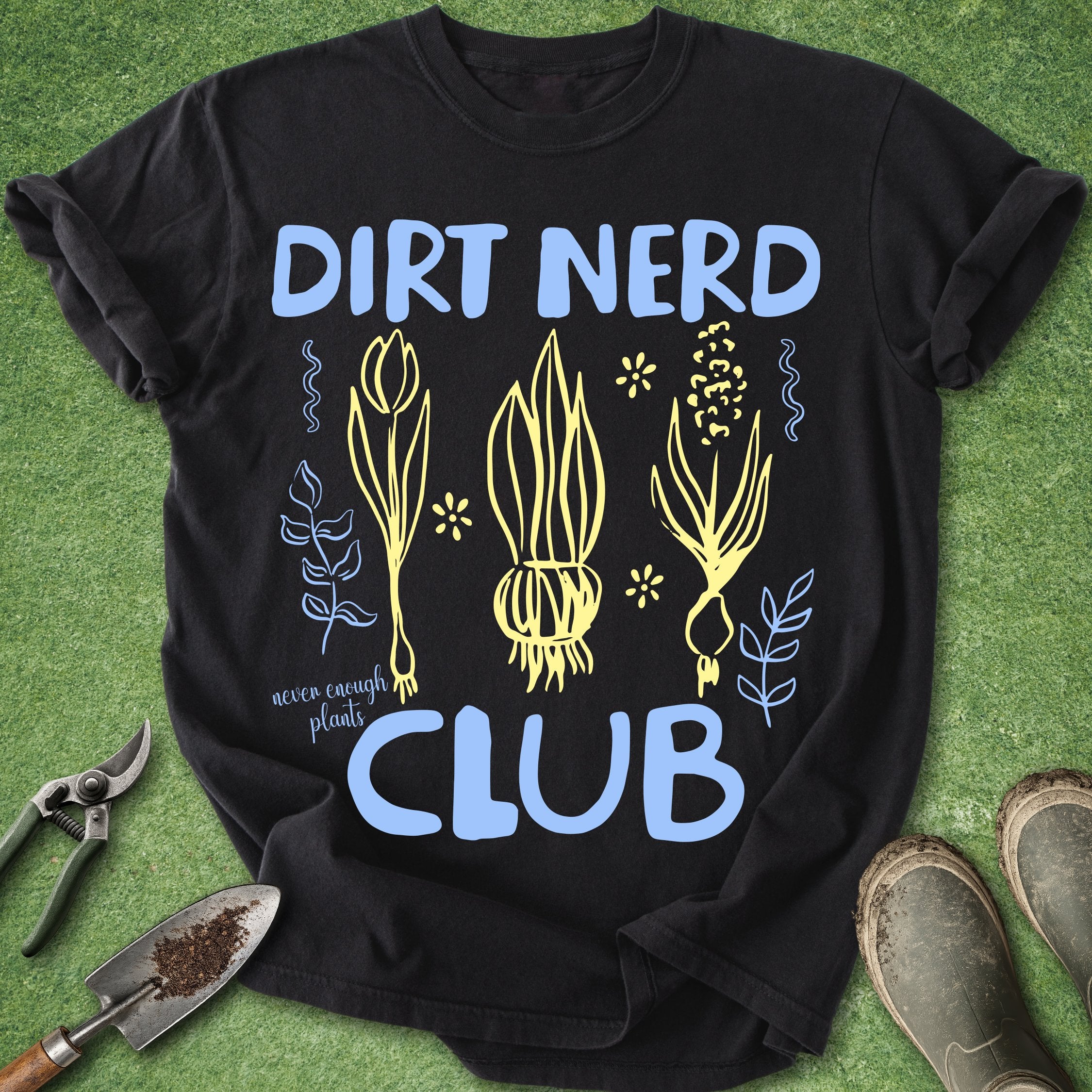 Black t-shirt with 'Dirt Nerd Club' design on a green grass background