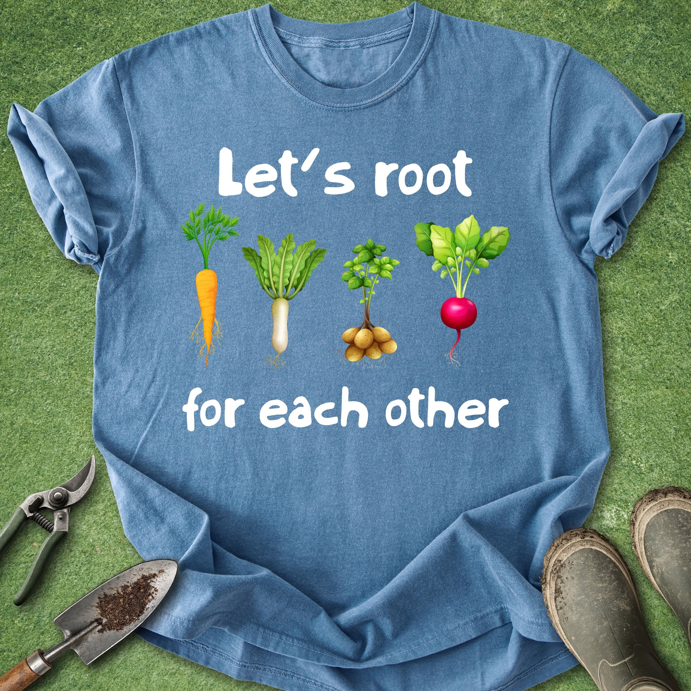 Blue t-shirt with vegetable graphics and text on a green background