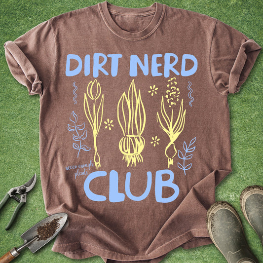 Brown t-shirt with 'Dirt Nerd Club' design on a grass background