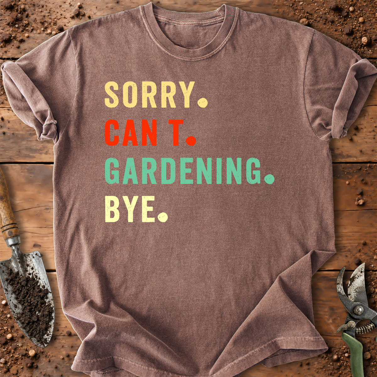 A brown short-sleeve t-shirt with the text 'SORRY. CAN'T.