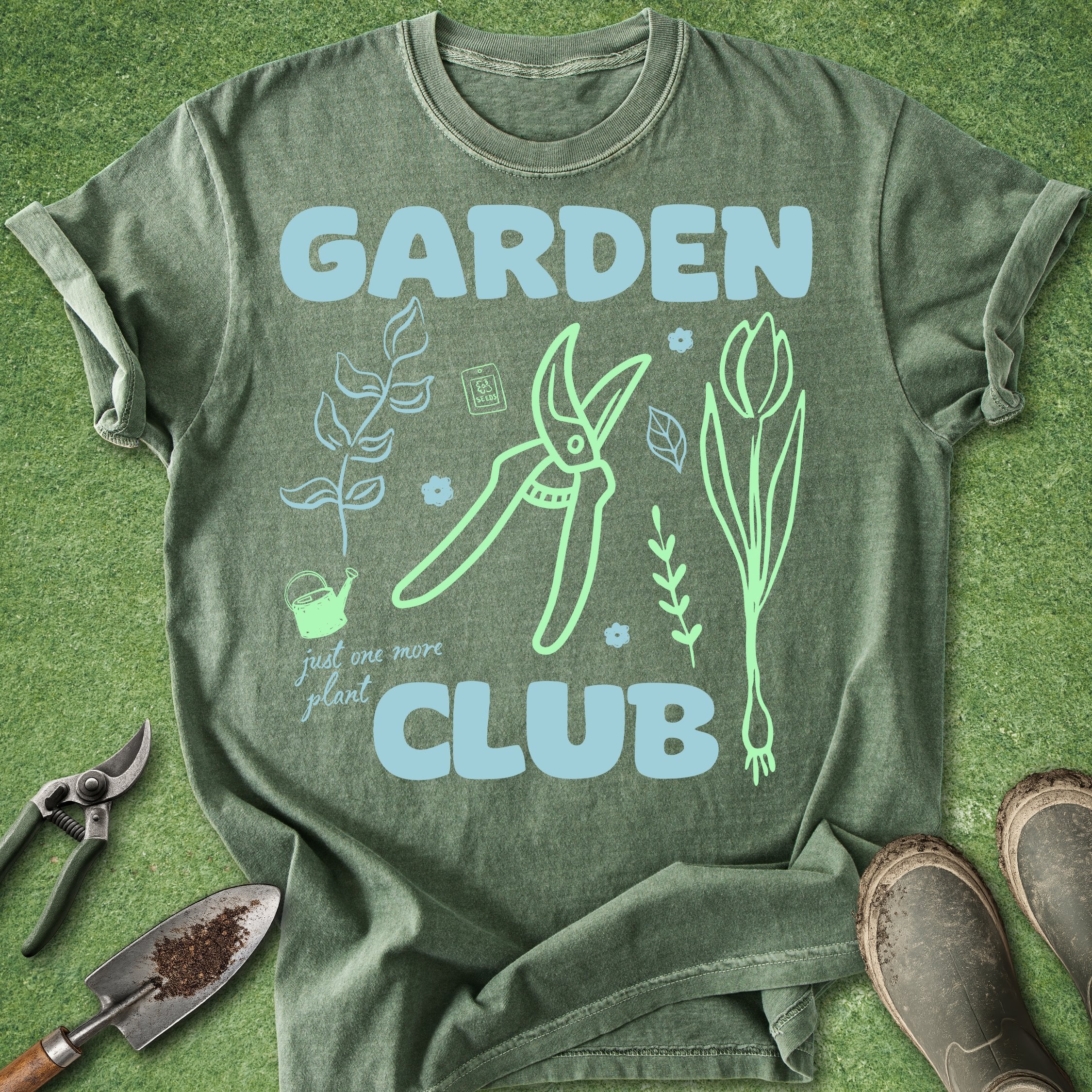 Green t-shirt with 'Garden Club' design on a grass background