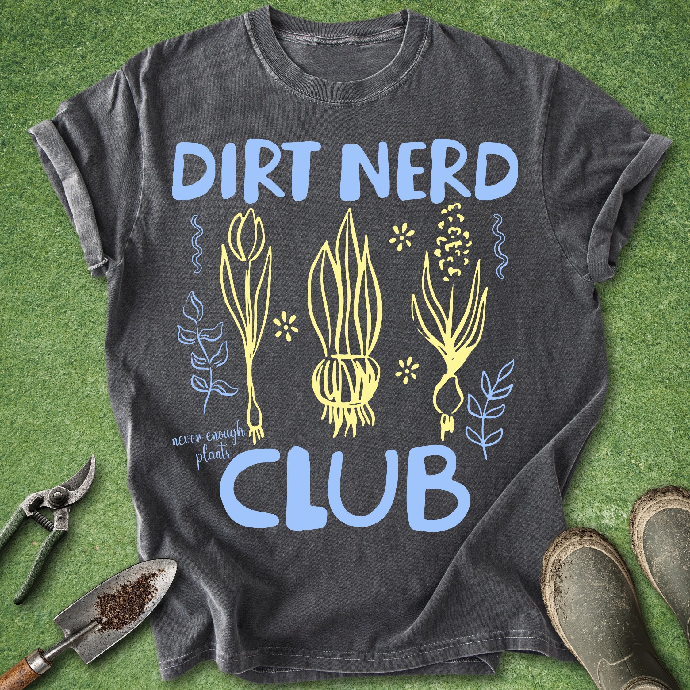 Black t-shirt with 'Dirt Nerd Club' design on a green grass background
