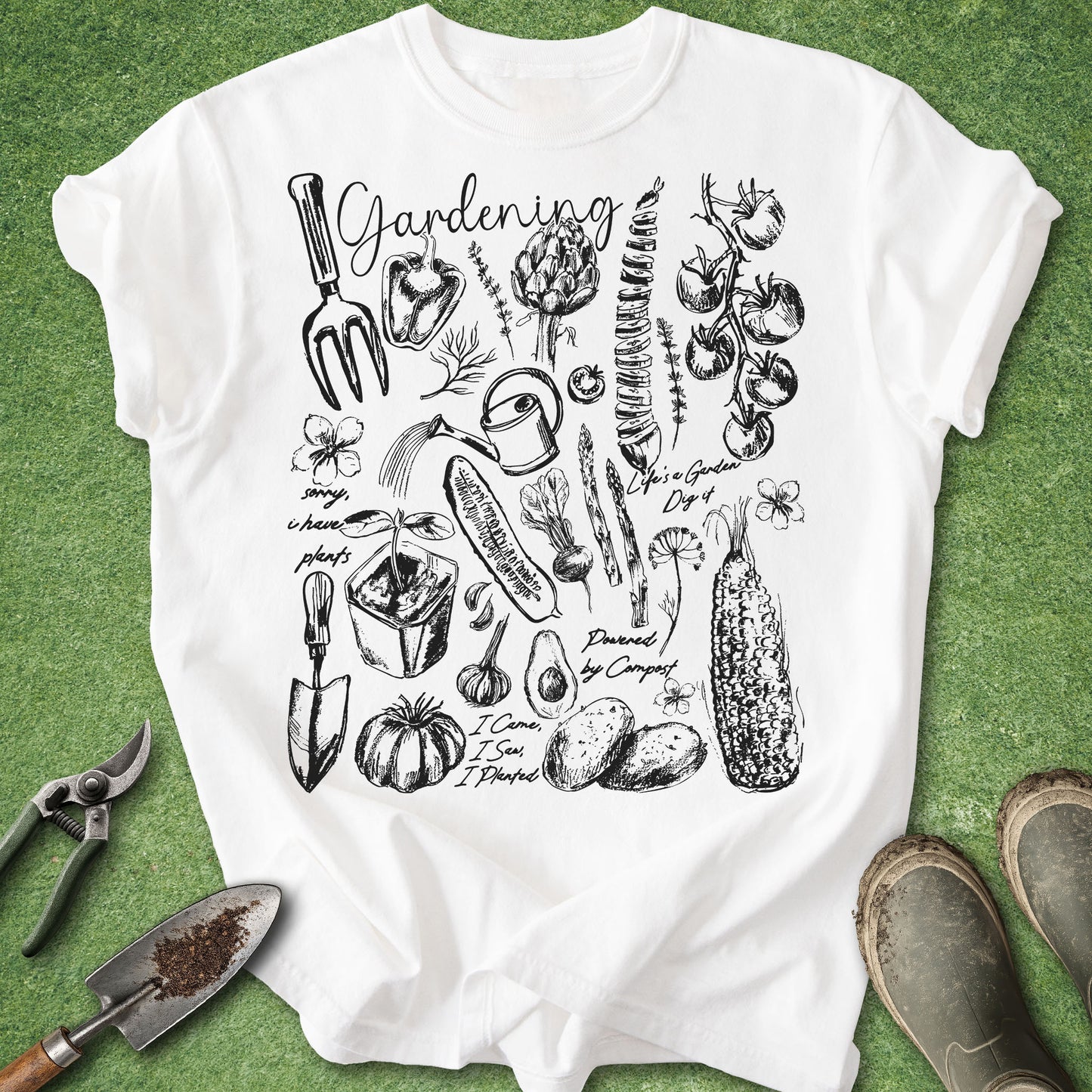 White t-shirt with black gardening illustrations on a green background