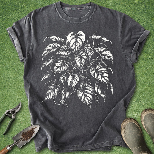 Pepper t-shirt featuring a detailed white botanical illustration of a lush Golden Pothos houseplant with cascading heart-shaped leaves.