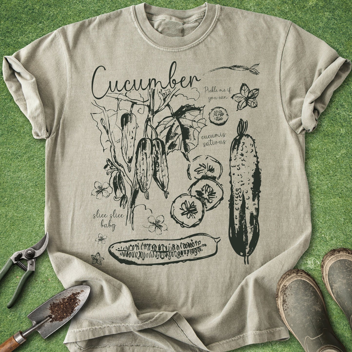 Beige t-shirt with cucumber graphic design on a green background