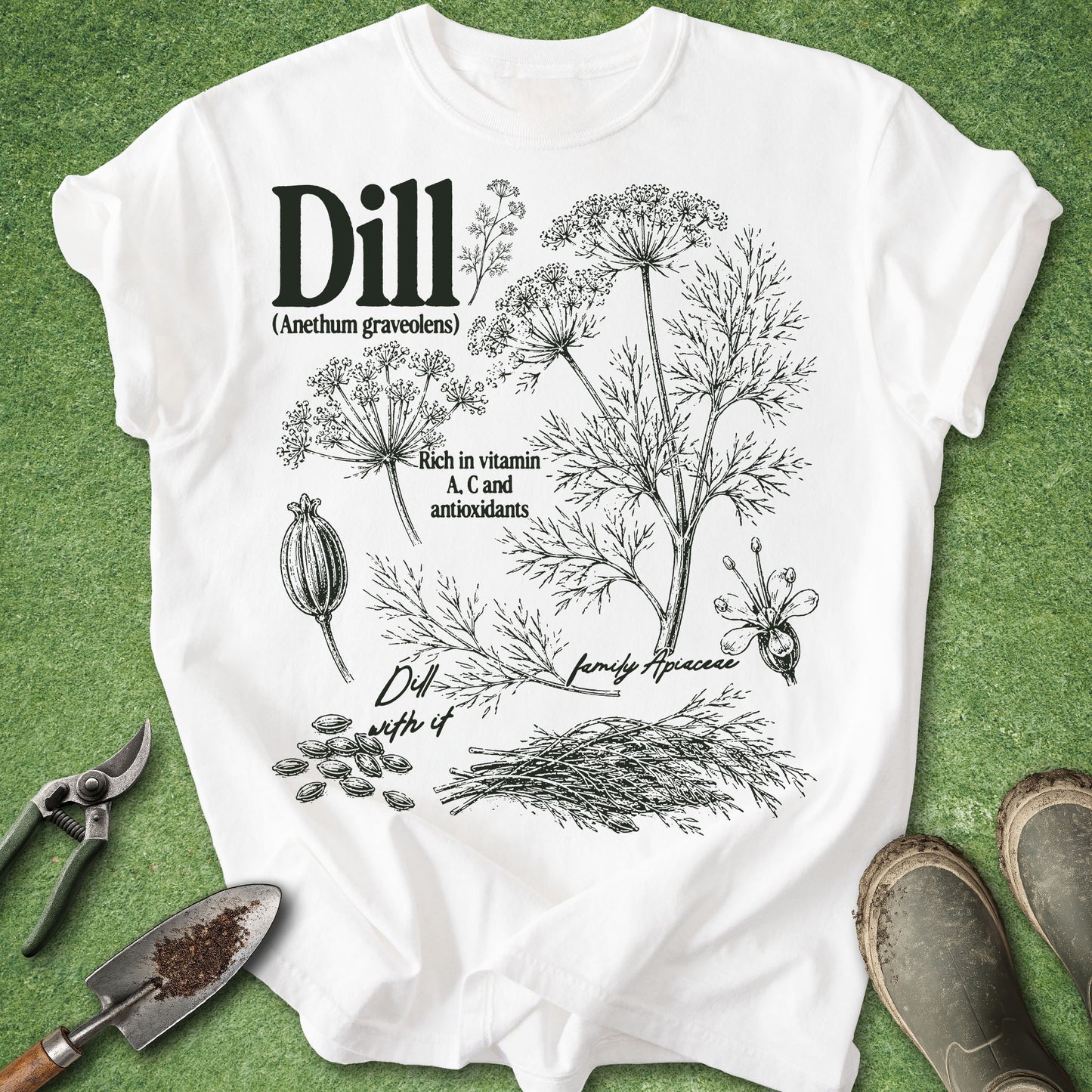 White t-shirt with dill plant illustration and text on a green background