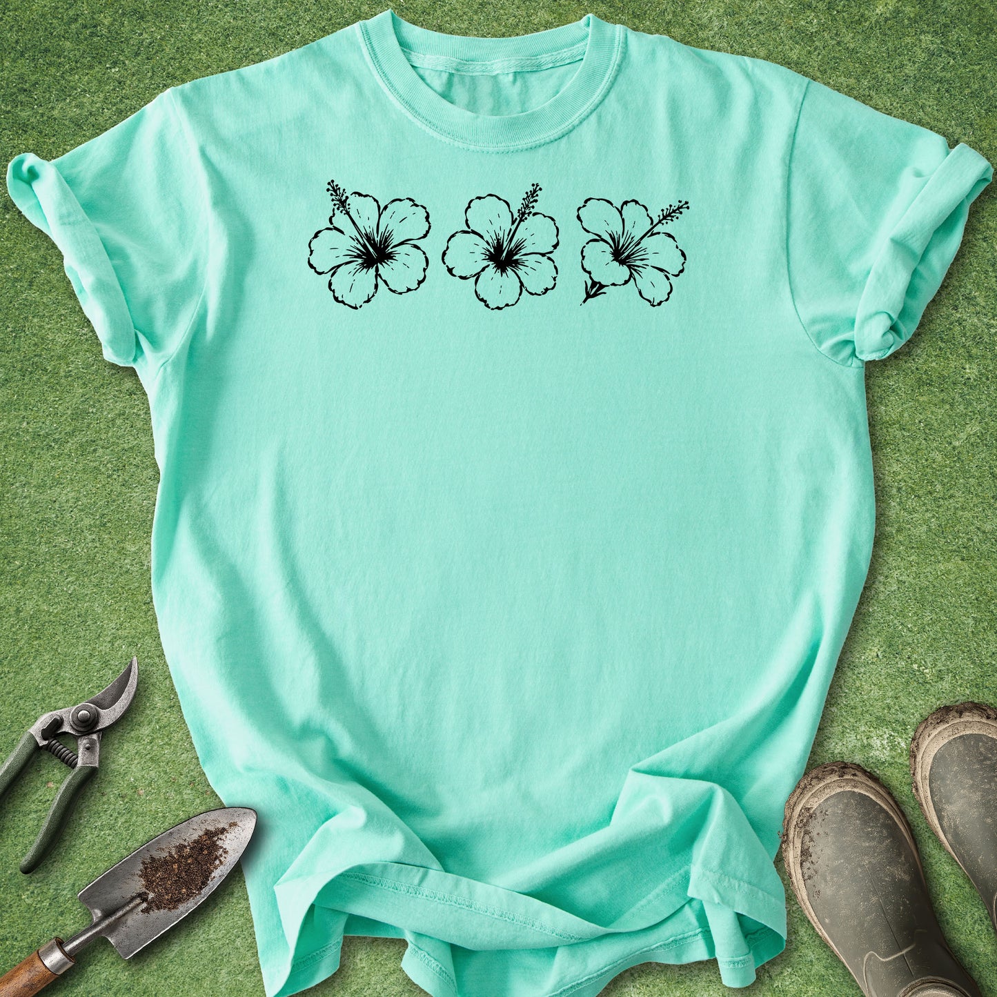 island reef Comfort Colors t-shirt featuring three distressed white hibiscus flowers arranged across the upper chest.