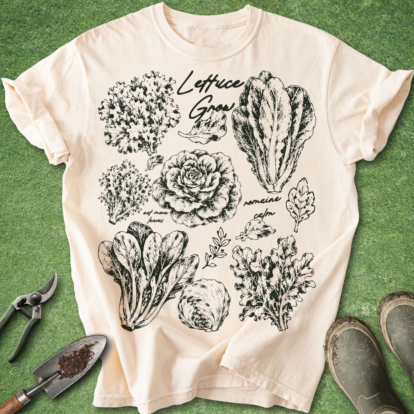 Ivory Comfort Colors t-shirt featuring vintage botanical illustrations of multiple lettuce varieties with the phrase "Lettuce Grow."