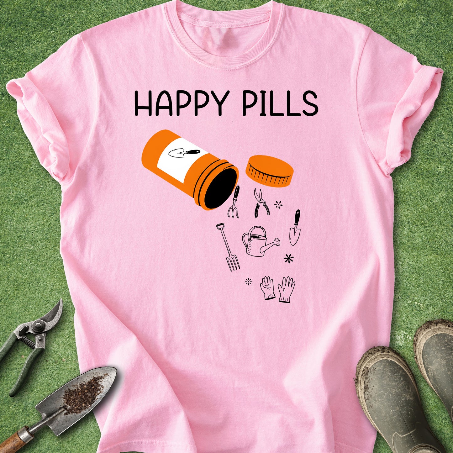 Pink t-shirt with 'Happy Pills' graphic and gardening tools on a green background